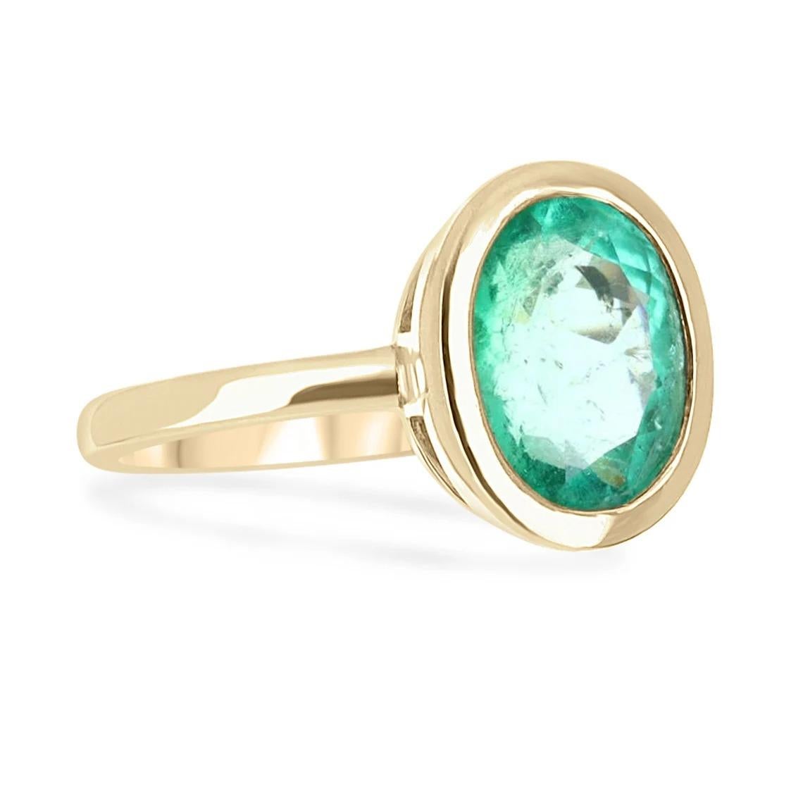 Simple, sophisticated, and elegant- that is what this gorgeous ring displays. A beautiful and vivid, medium green, oval cut with excellent luster set into an 18K yellow gold bezel set, solitaire setting. Admirable from any angle.

Setting Style: