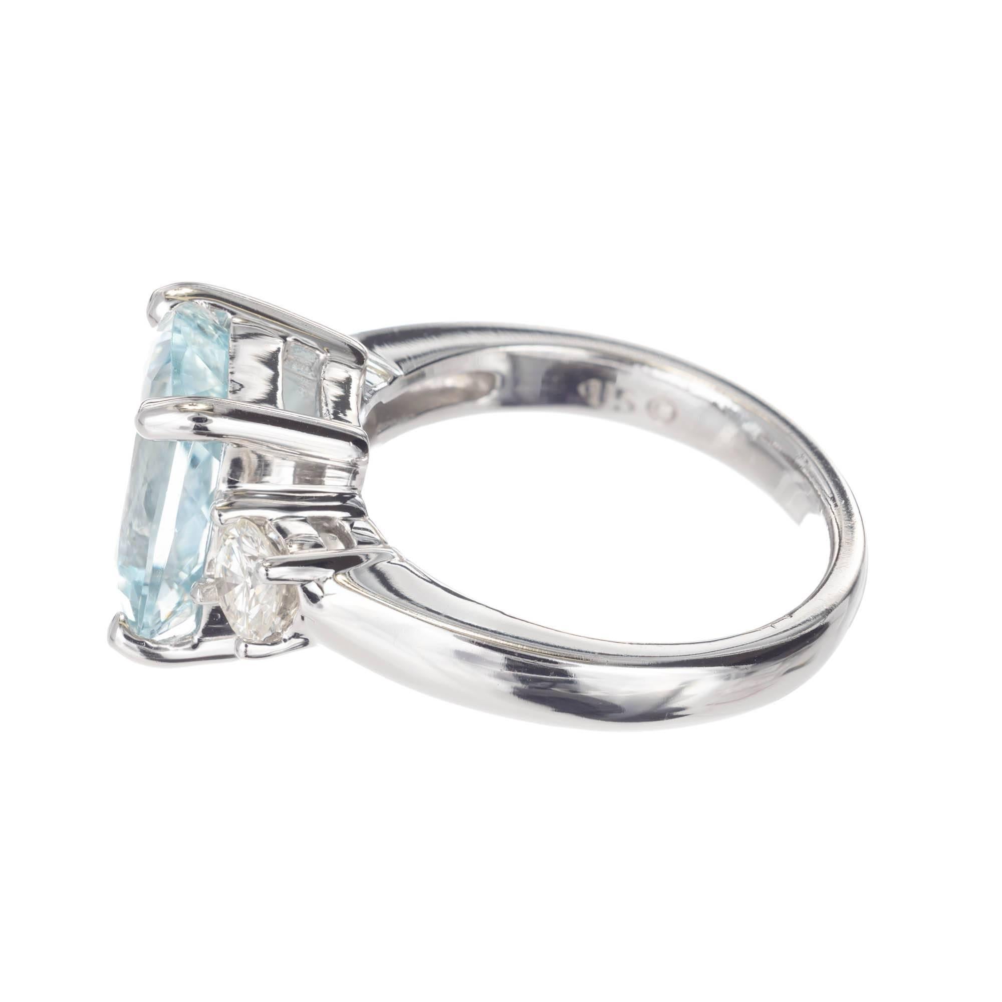 Natural blue bright well cut Aqua and diamond engagement ring 3.97 carats in a solid white gold settings with two round side accent diamonds. Circa 1980. The auqa has a  slight greenish hue .

1 cushion bright greenish blue Aqua, approximate total