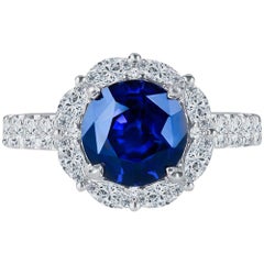3.97 Carat GIA Round Natural Blue Sapphire Set in 18 Karat Diamond Halo Ring