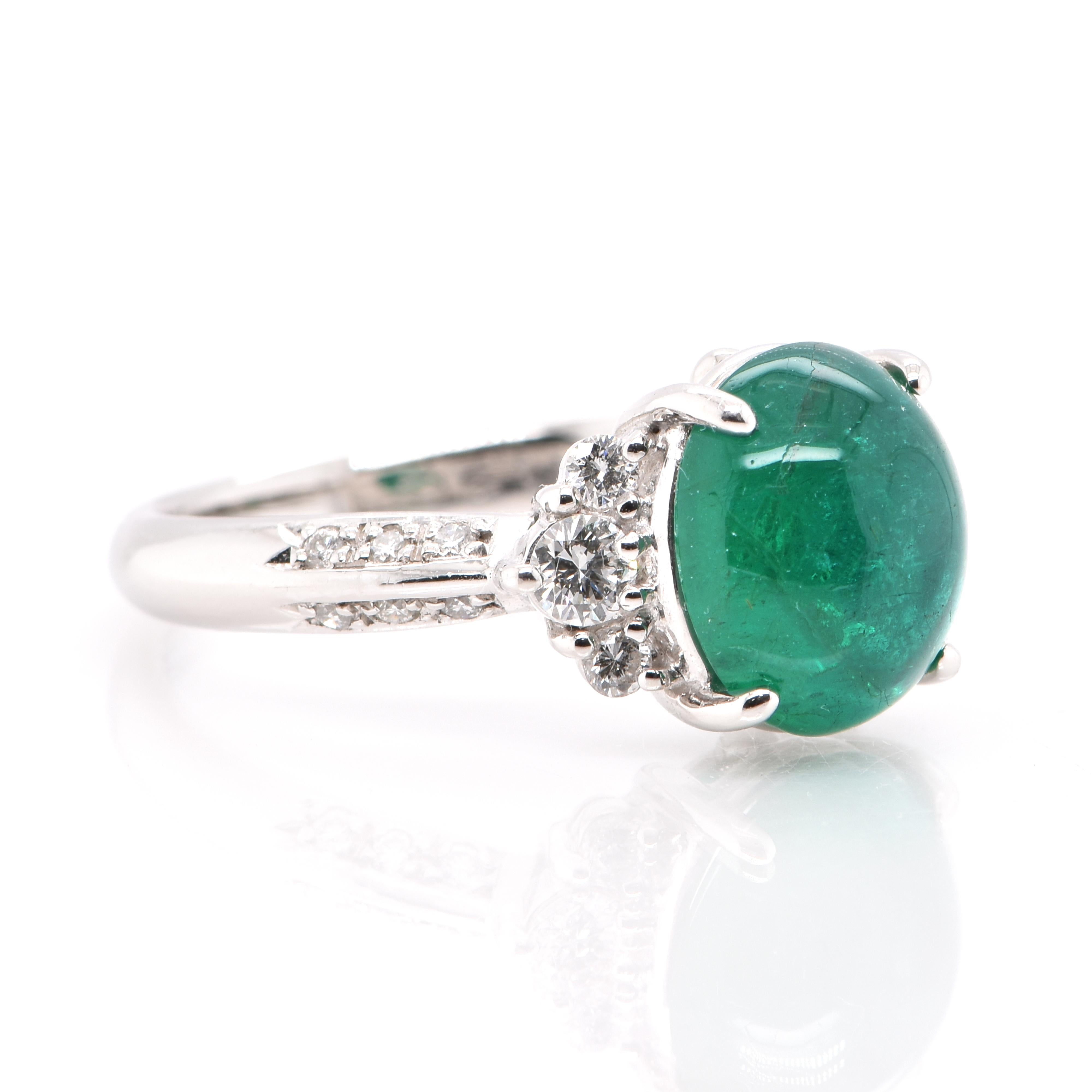 A stunning Ring featuring a 3.97 Carat, Natural, Colombian Emerald Cabochon and 0.45 Carats of Diamond Accents set in Platinum. People have admired emerald’s green for thousands of years. Emeralds have always been associated with the lushest