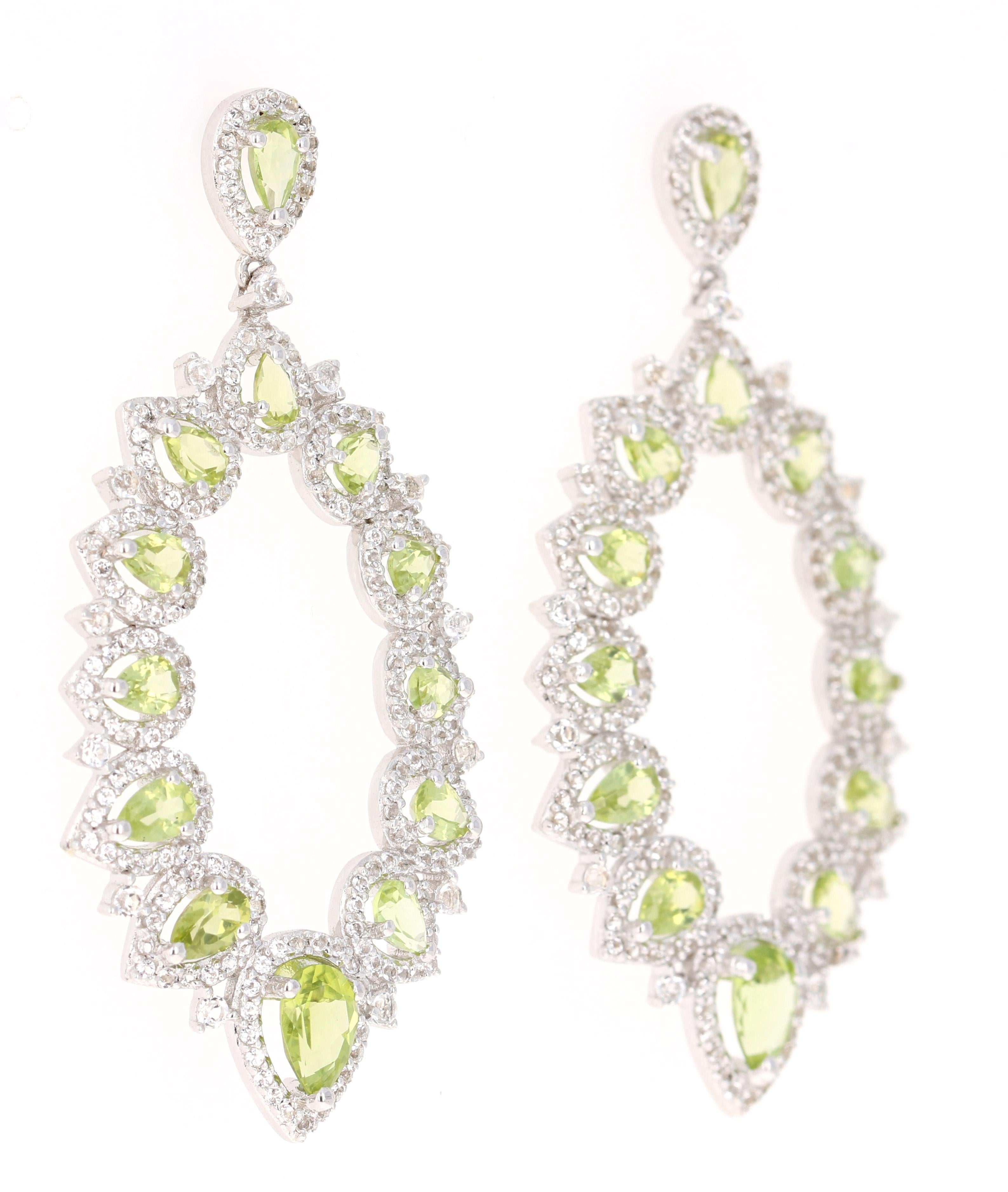 Stunning Chandelier Dangle Earrings 

These earrings have 3.97 Carats of Peridot and White Topaz

They are beautifully curated in 925 Silver.

They are 2 inches long. 
