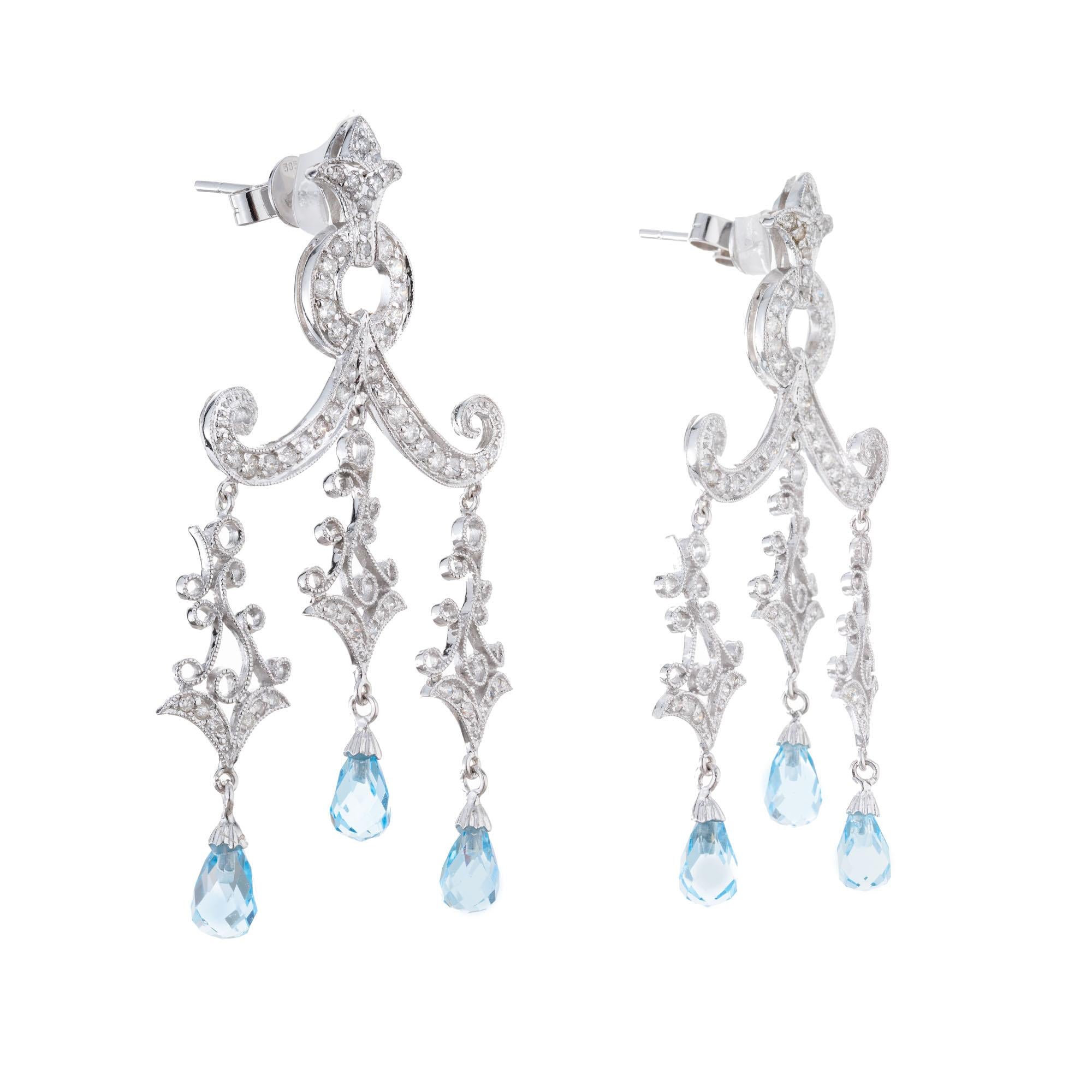Six Briolette shaped Topaz with 112 round full cut diamonds in 14k white gold dangle chandelier style earrings. 

6 Briolette Blue Topaz approx. total weight 3.00ct
112 round full cut diamonds, approx. total weight .97cts, SI1
14k white