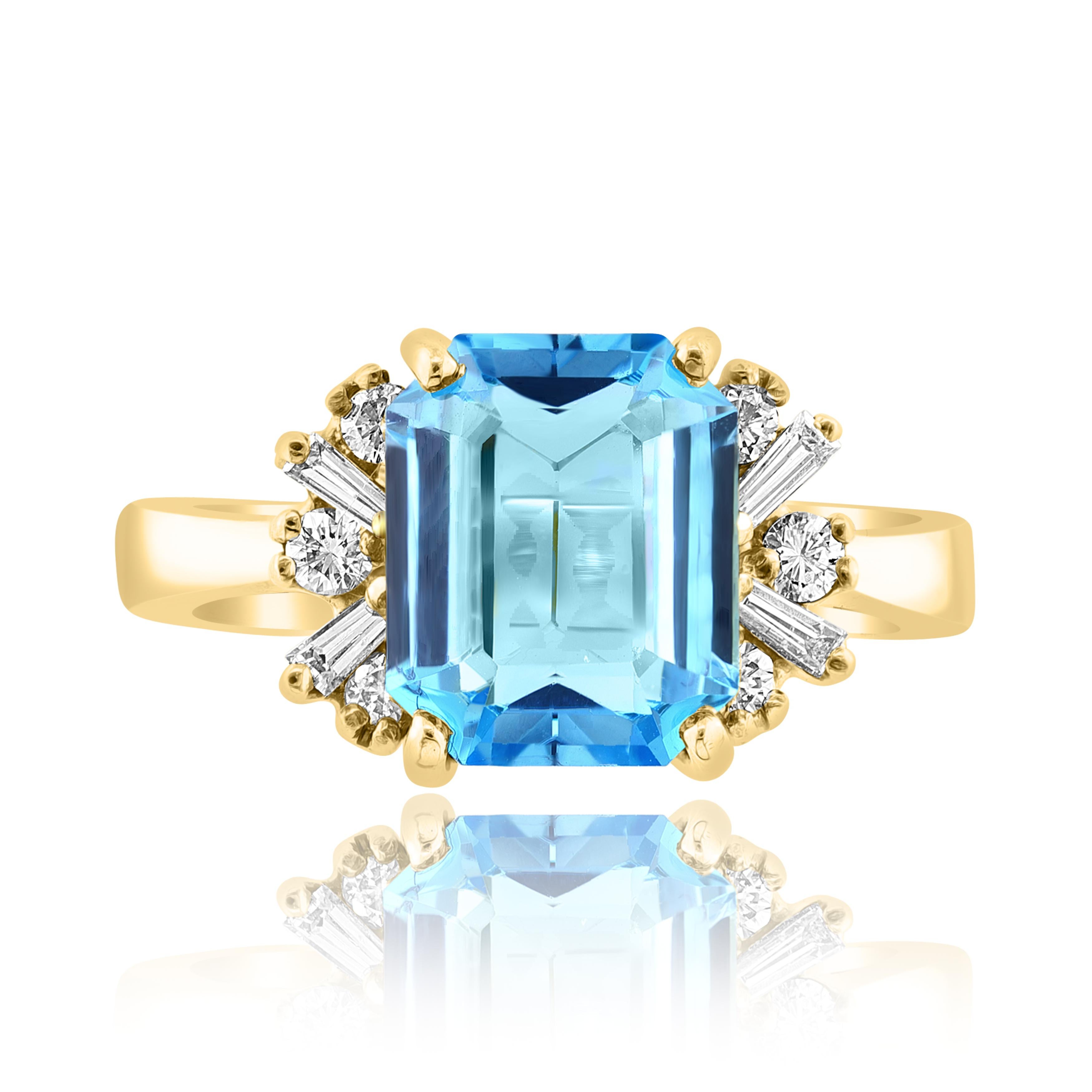 This classic ring with Emerald Cut blue topaz in the center is 3.98 carat with mixed cut diamonds on both sides. 6 round diamonds and 4 baguette diamonds weigh 0.19 carat and are made of 14K Yellow Gold.