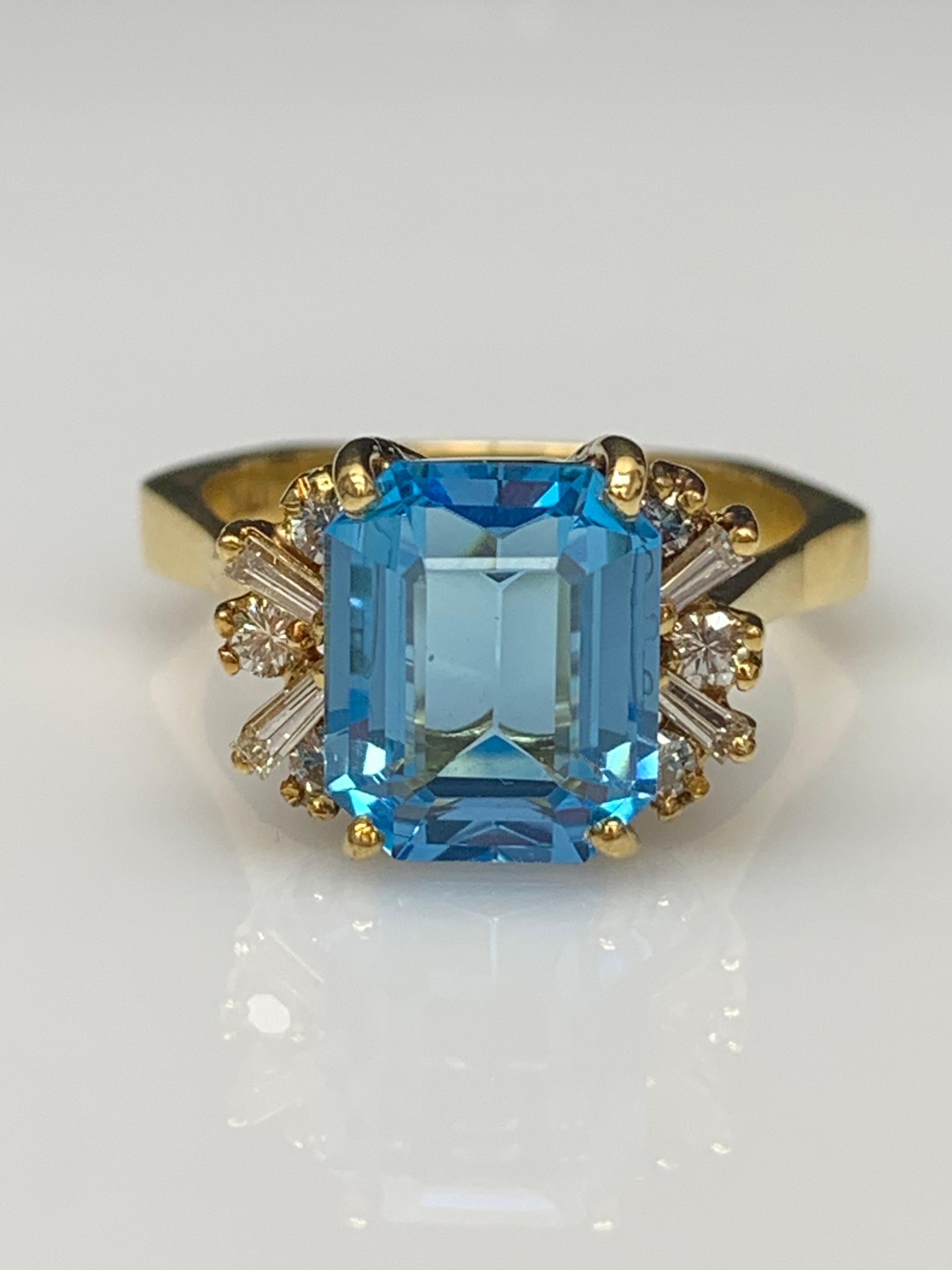 Modern 3.98 Carat Emerald Cut Blue Topaz and Diamond Ring in 14K Yellow Gold For Sale