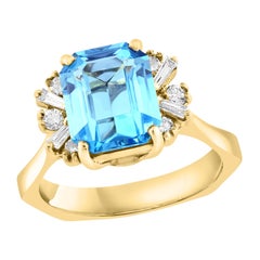 Anello con topazio blu taglio smeraldo e diamanti da 3,98 carati in oro giallo 14K