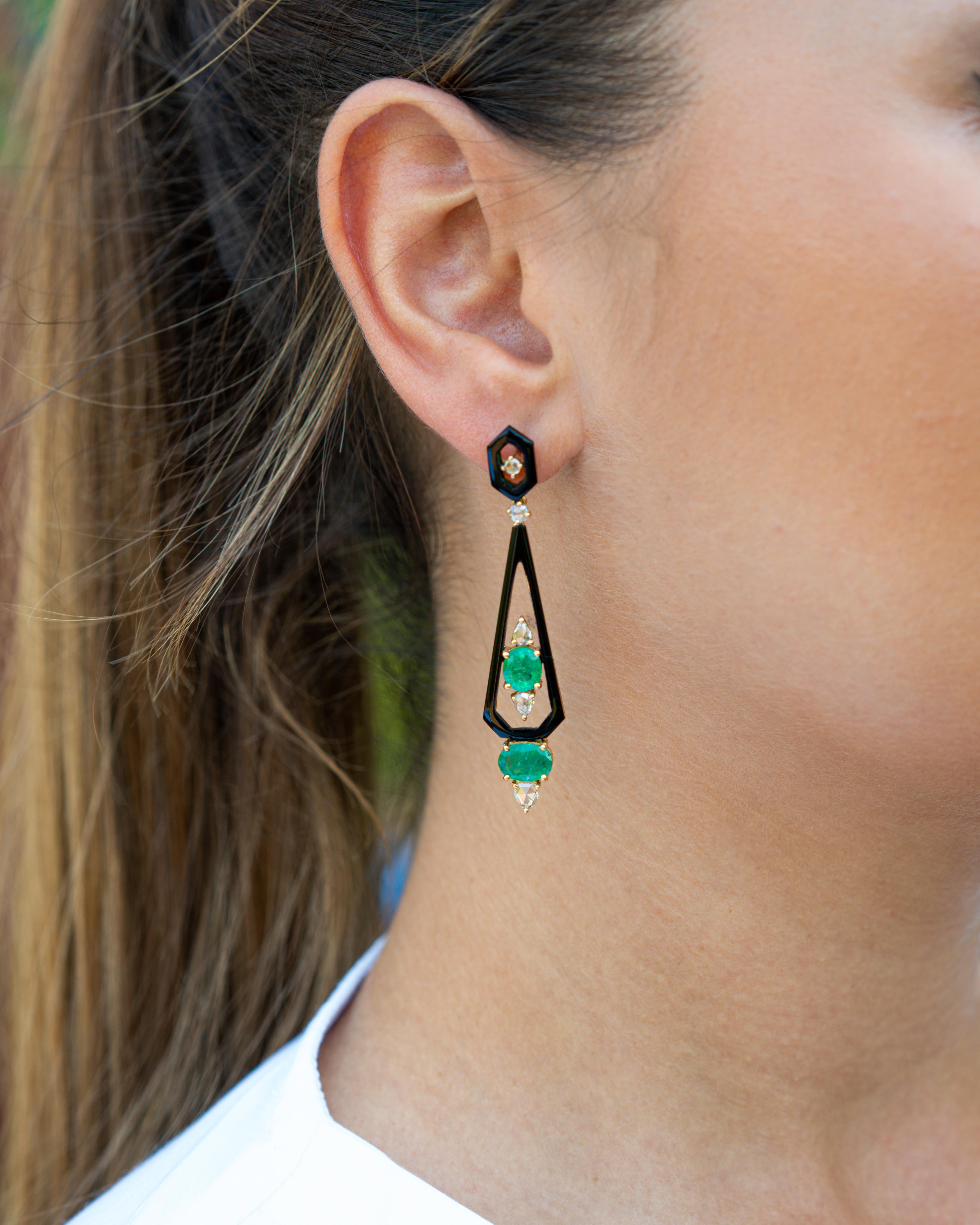 An art-deco looking pair of earrings, with beautiful Zambian Emeralds, brilliant cut and rose cut Diamonds and Black Onyx. The earrings are set in solid 18K Yellow Gold. 
Free shipping. Returns accepted. Video available.
Message us for more