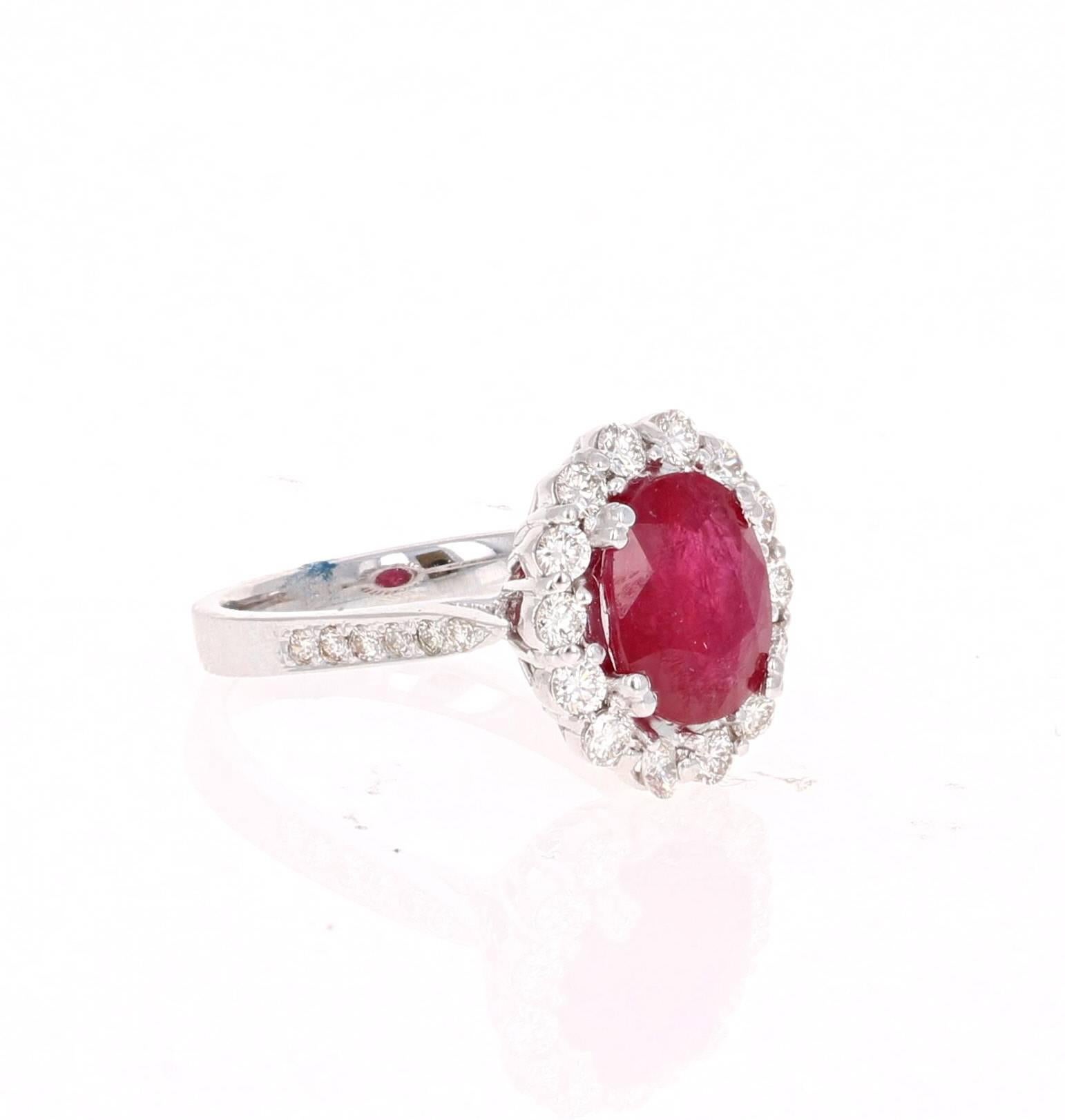 This classic design can transform into a modern Engagement/Promise ring!

It has an Oval Cut Ruby that is 3.28 Carats and is surrounded by 26 Round Cut Diamonds that weigh 0.70 carats (Clarity: VS2, Color: H). 
It is set delicately in 18K White Gold