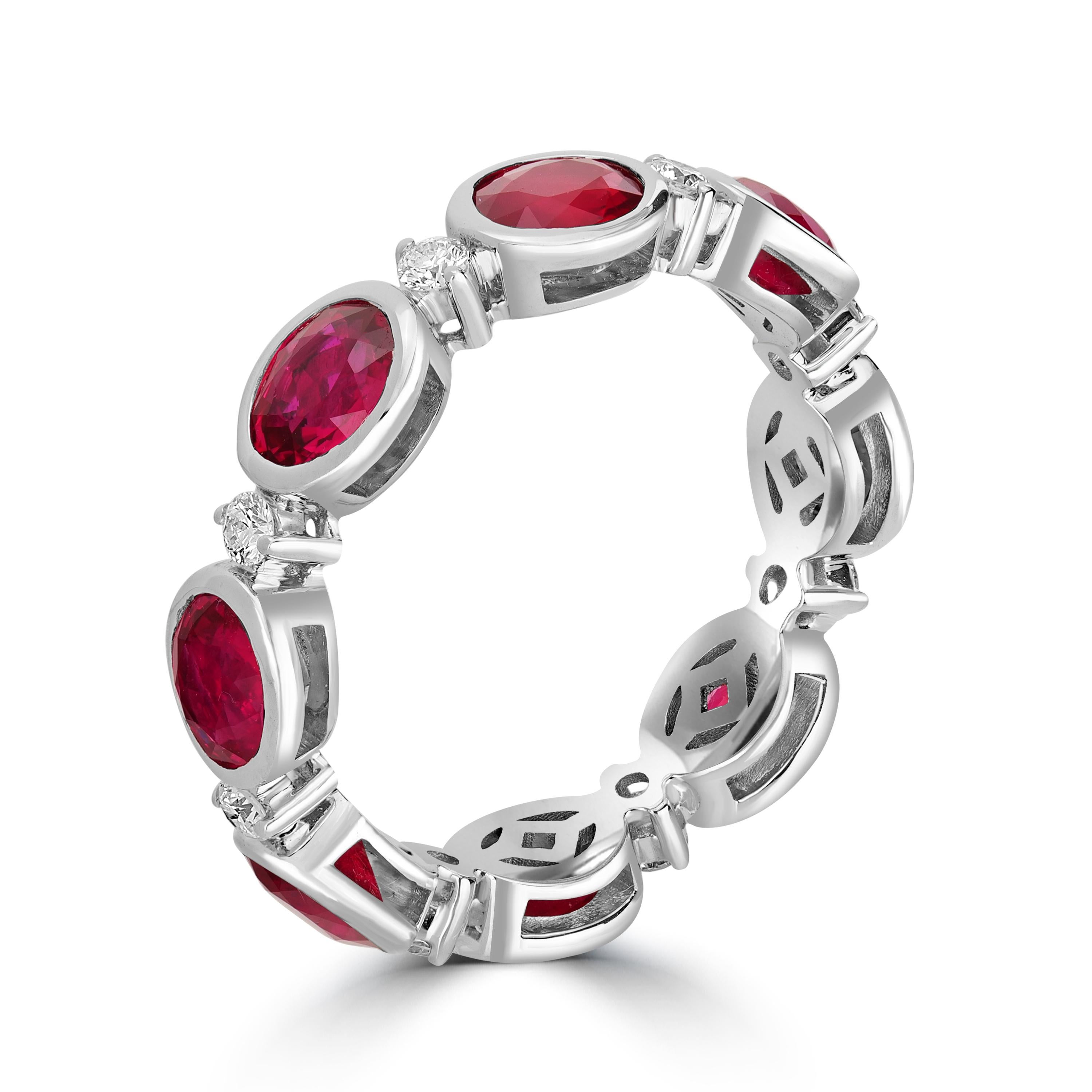 This spectacular ruby and diamond eternity band ring is the one for your jewelry collection. Set in bezel setting, this ring has rubies from Mozambique known for its exquisite pinkish red hue, The diamonds used are of G-H color and SI clarity. The