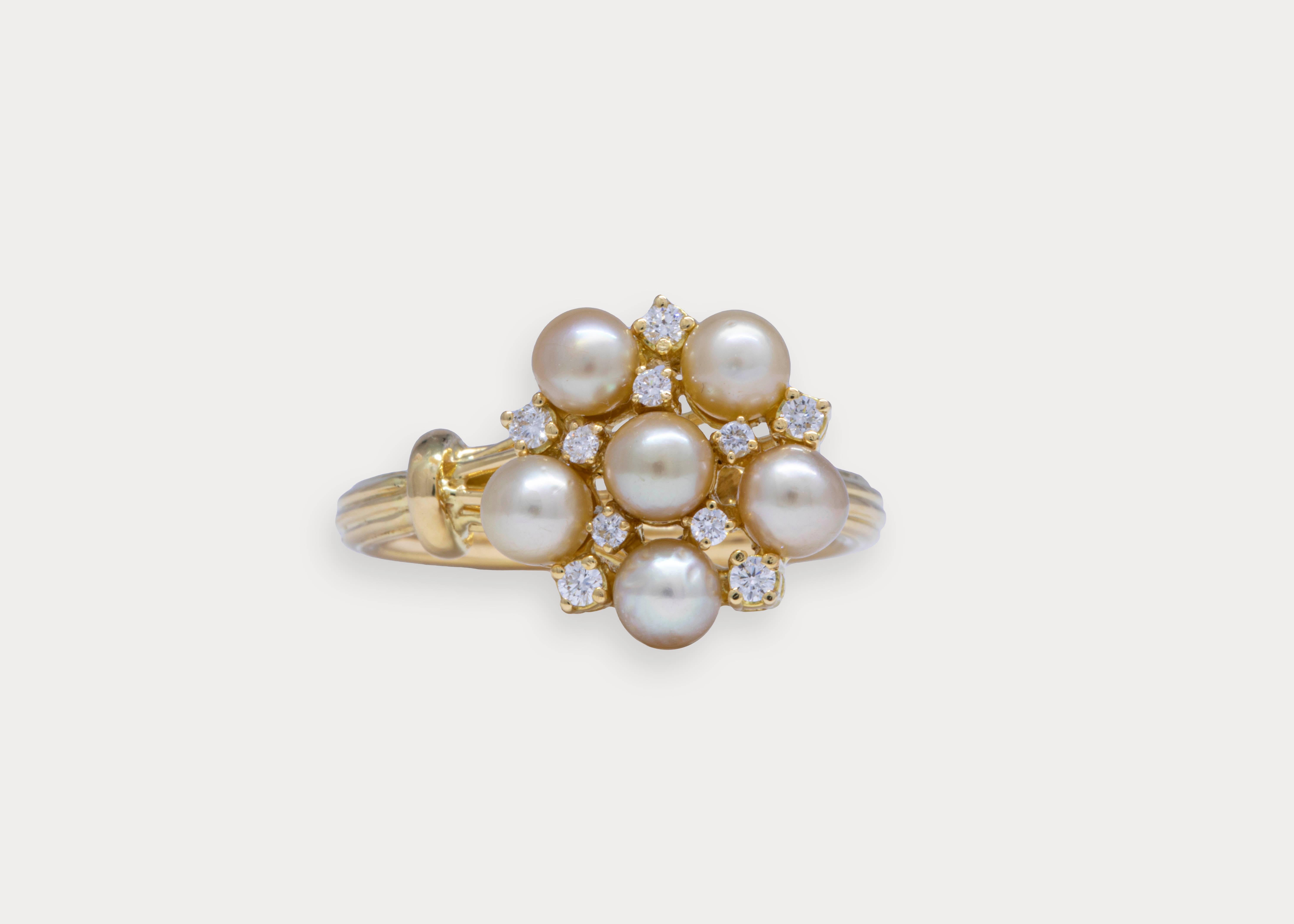 A flower stem wraps elegantly around your fingers.
The petals are 3.98 ct. of lustrous cream colored Bahraini natural pearls with scattered VS1 round diamonds in between.

Gold Weight: 7.94 g
6 Pearls Weight: 3.98 ct.
Diamond Weight: 0.19 ct.
