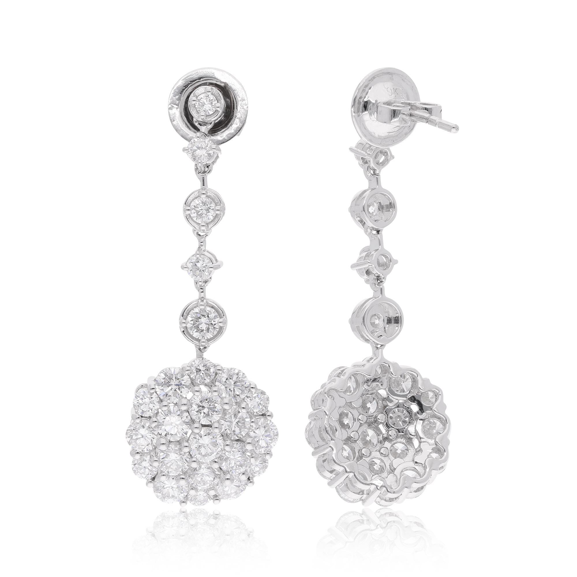 These exquisite dangle earrings are a testament to fine craftsmanship and timeless elegance. They boast a total carat weight of 3.99 carats of diamonds, creating a captivating and luxurious display of brilliance.

Item Code :- STE-1267B
Gross Wt. :-