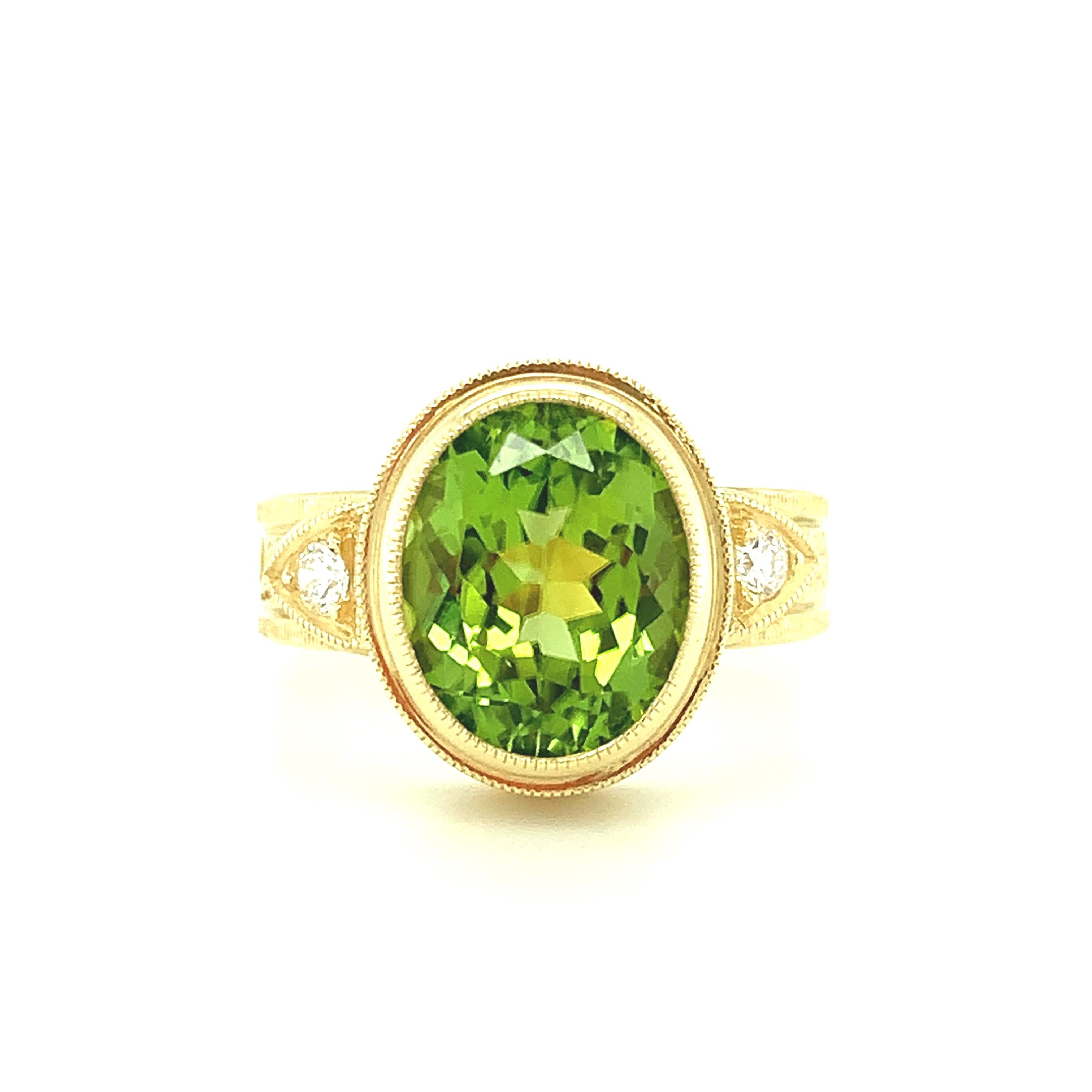 This handmade 18k yellow gold ring features a bright, crystalline peridot with beautiful color and exceptional brilliance. Our signature ring was designed to showcase a single gorgeous gem by setting it in an intricately engraved, multi-dimensional
