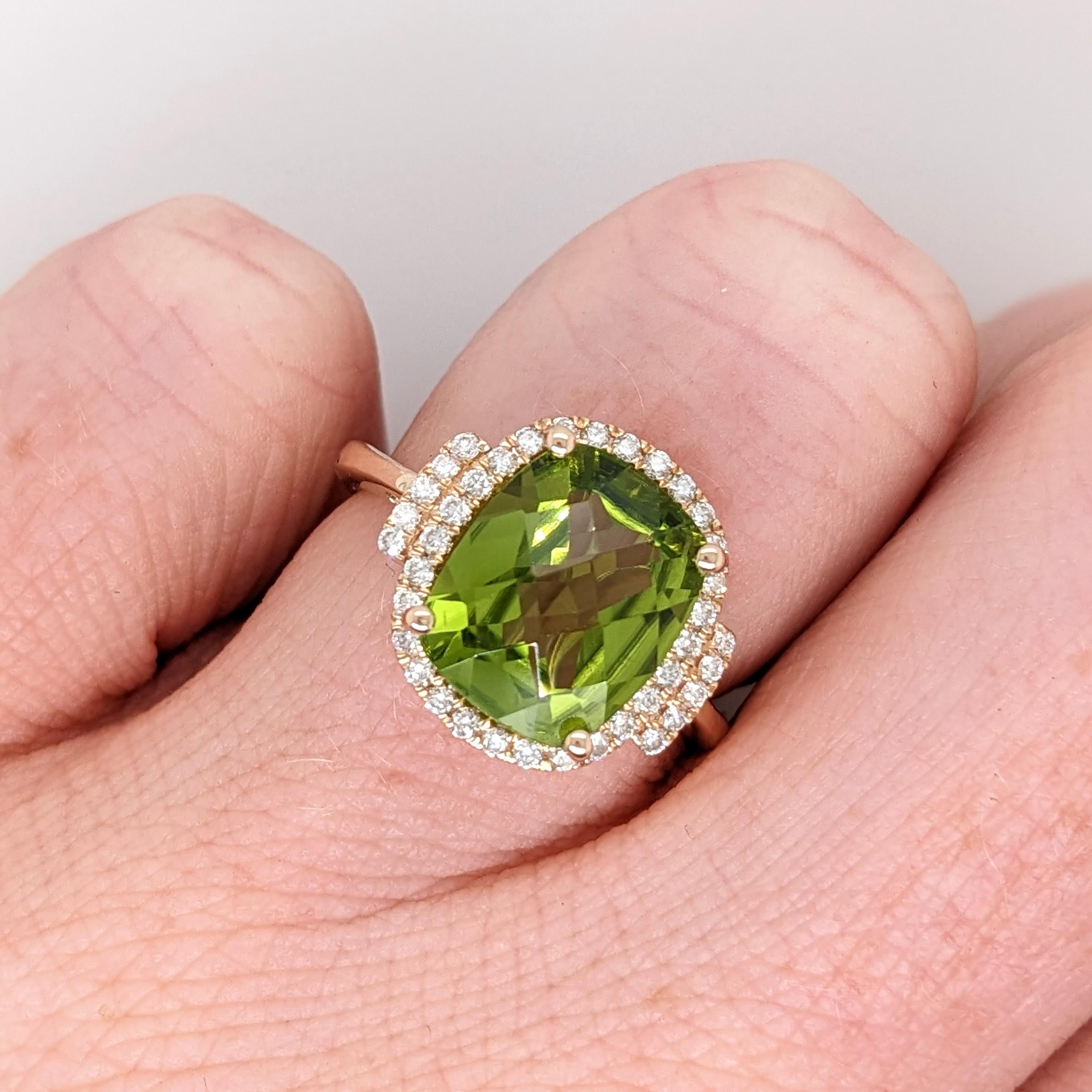 This beautiful ring features a gorgeous 11x9mm 4 carat cushion peridot in a stunning setting made in solid 14k yellow gold with all natural earth mined diamond accents. Enjoy the gorgeous shade of green and beautiful clarity of this natural peridot!