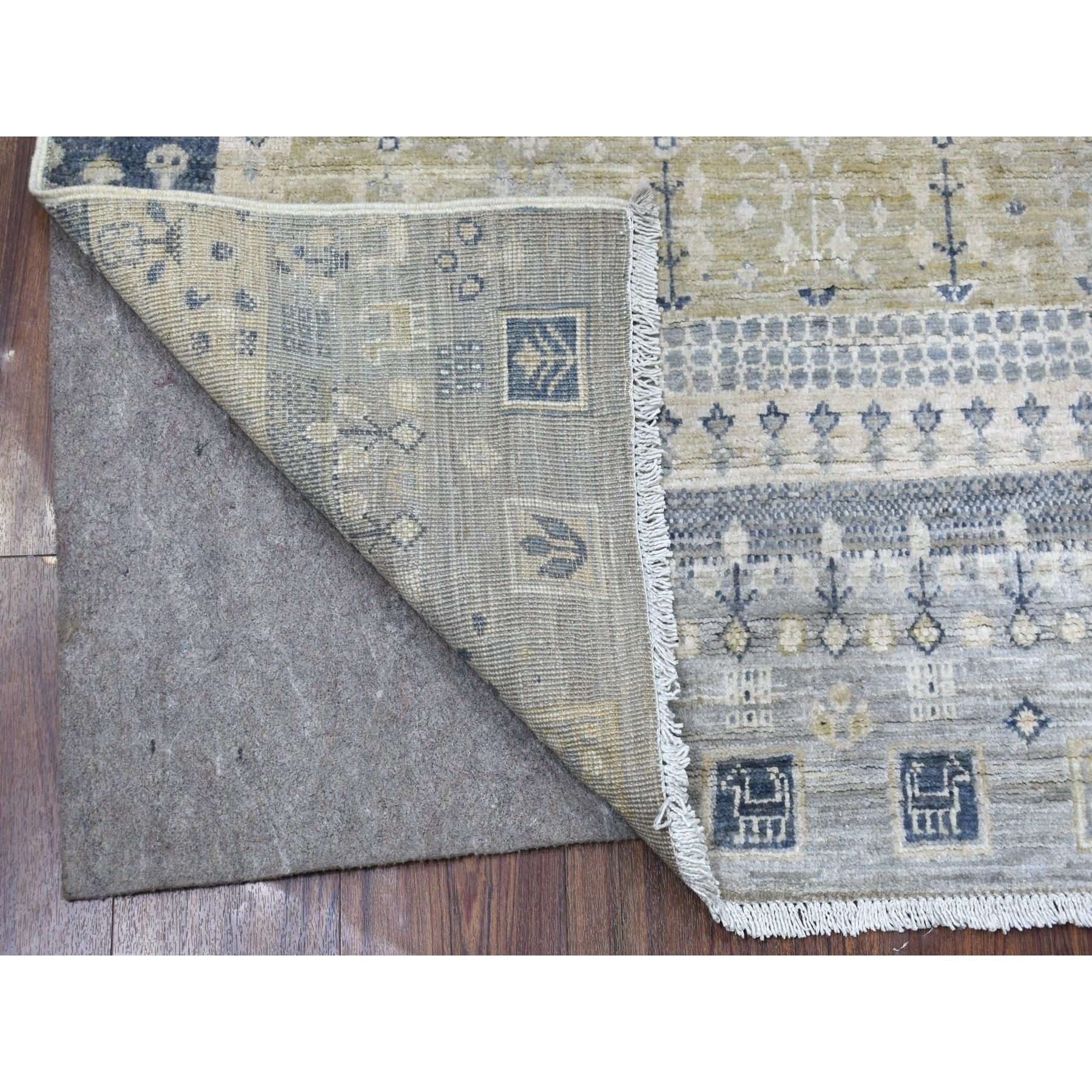 This is a truly genuine one-of-a-kind Hand-Knotted Ivory Kashkuli Gabbeh Nomadic Design Pure Wool Oriental Rug. It has been Knotted for months and months in the centuries-old weaving craftsmanship techniques by expert artisans.
Primary materials: