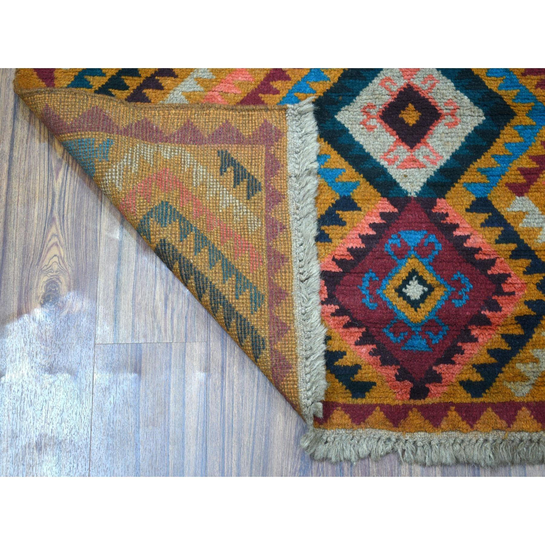 This is a truly genuine one-of-a-kind Orange Colorful Afghan Baluch Geometric Design Hand Knotted Pure Wool Oriental Rug. It has been woven for months and months in the centuries-old Persian weaving craftsmanship techniques by expert