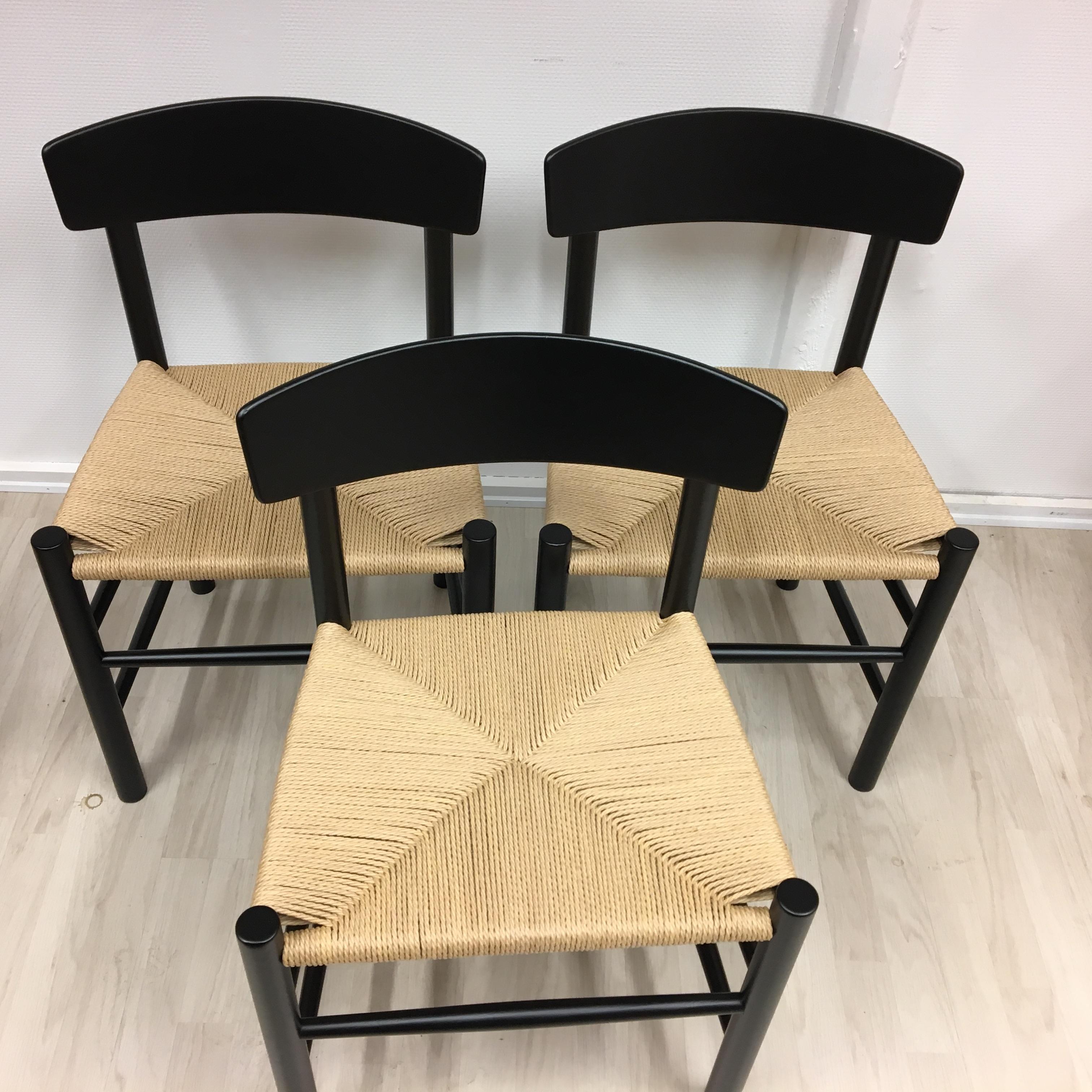These 3 Folkestol by Børge Mogensen are freshly varnished and with new handwoven natural paper wicker. Stone has new furniture shoes and was made from Fredericia Furniture in 1983. This chair was designed for the FDB, the Danish Cooperative, in 1947.