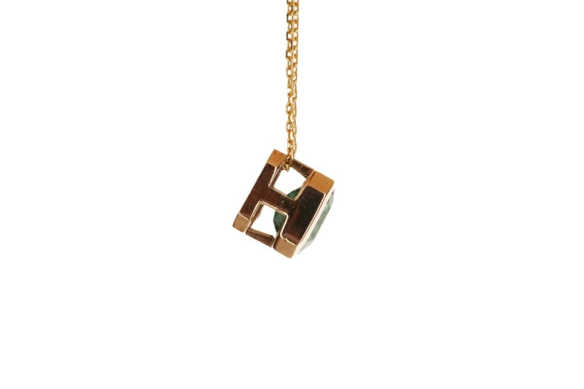 A beautiful 3ct emerald, bezel-set, slider pendant in 14K yellow gold. A clean gold bezel wraps itself around the gemstone, making sure it is 100% protected on its edges. A wide window can accommodate small to average-sized chains. This piece is one