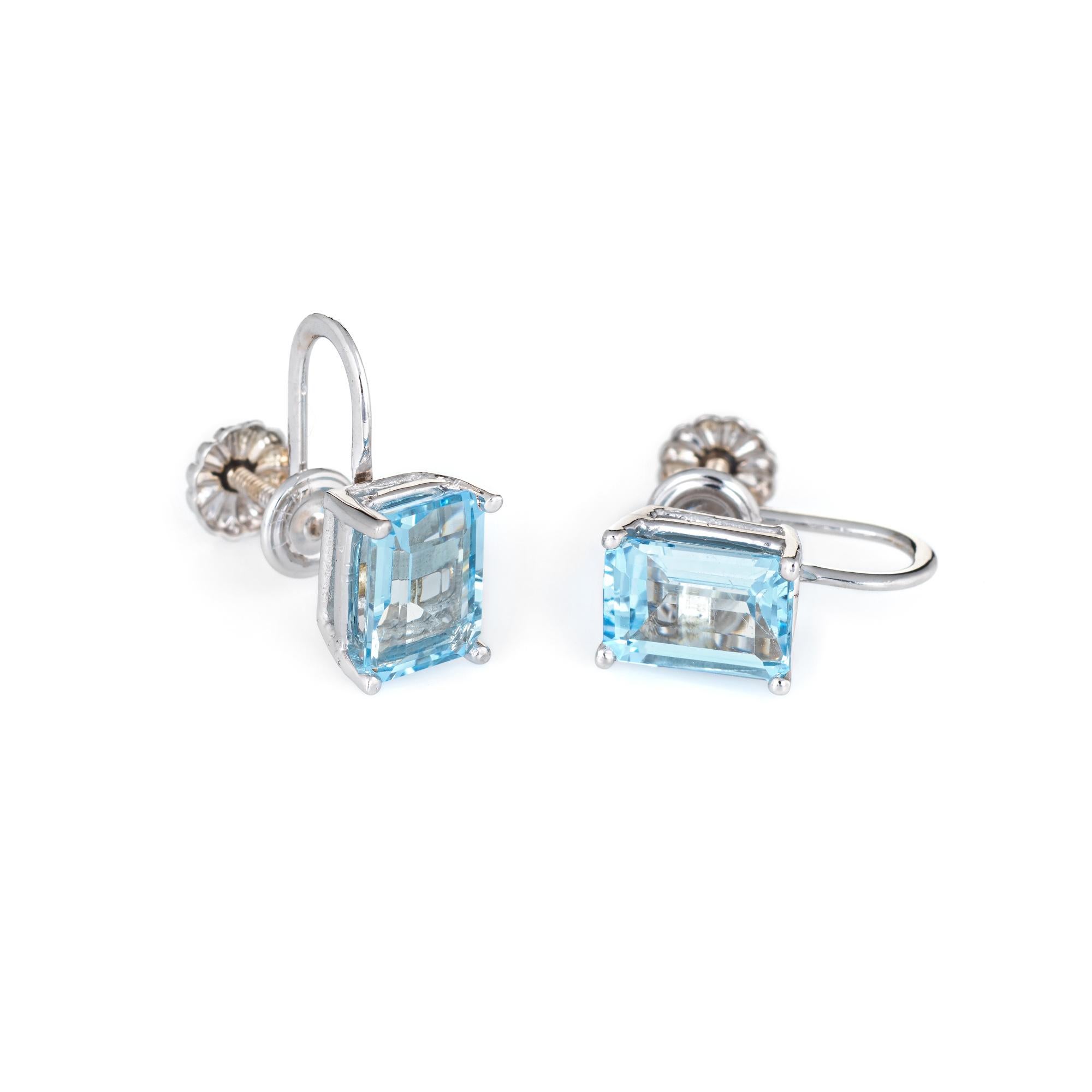 Elegant pair of blue topaz earrings crafted in 14k white gold. 

Emerald cut blue topaz measures 8mm x 6mm (estimated at 1.50 carats each - 3 carats total estimated weight). The topaz is in excellent condition and free of cracks or chips.   

The