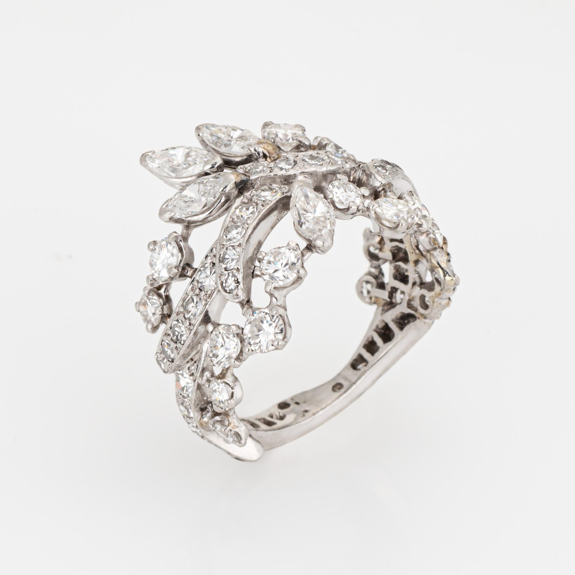 Stylish vintage diamond wreath band crafted in platinum (circa 1950s to 1960s). 

Mixed cut diamonds (marquise, round brilliant & single cuts) total an estimated 3 carats (estimated at I-J color and VS2-I1 clarity). 

The wide band highlights a