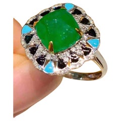 3ct Emerald Cabochon Ring in 18K Gold with 0.30ct Diamond Halo 
Turquoise