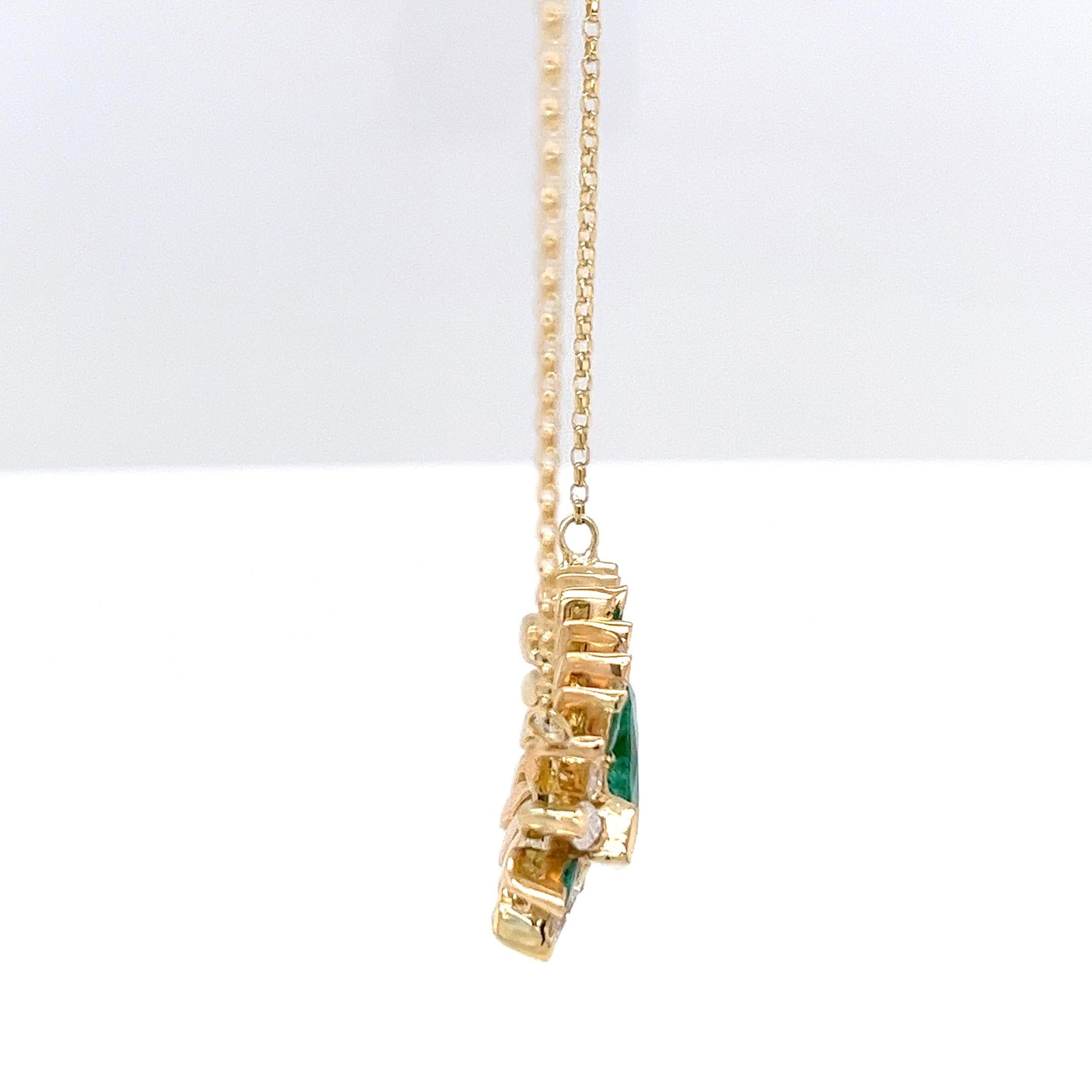 A striking display of elegance and vibrant colour, 
this exquisite pendant features a rich 3.00ct natural emerald at its centre, set in luxurious 18ct yellow gold. The emerald is gracefully surrounded by 1.30ct of natural marquise cut