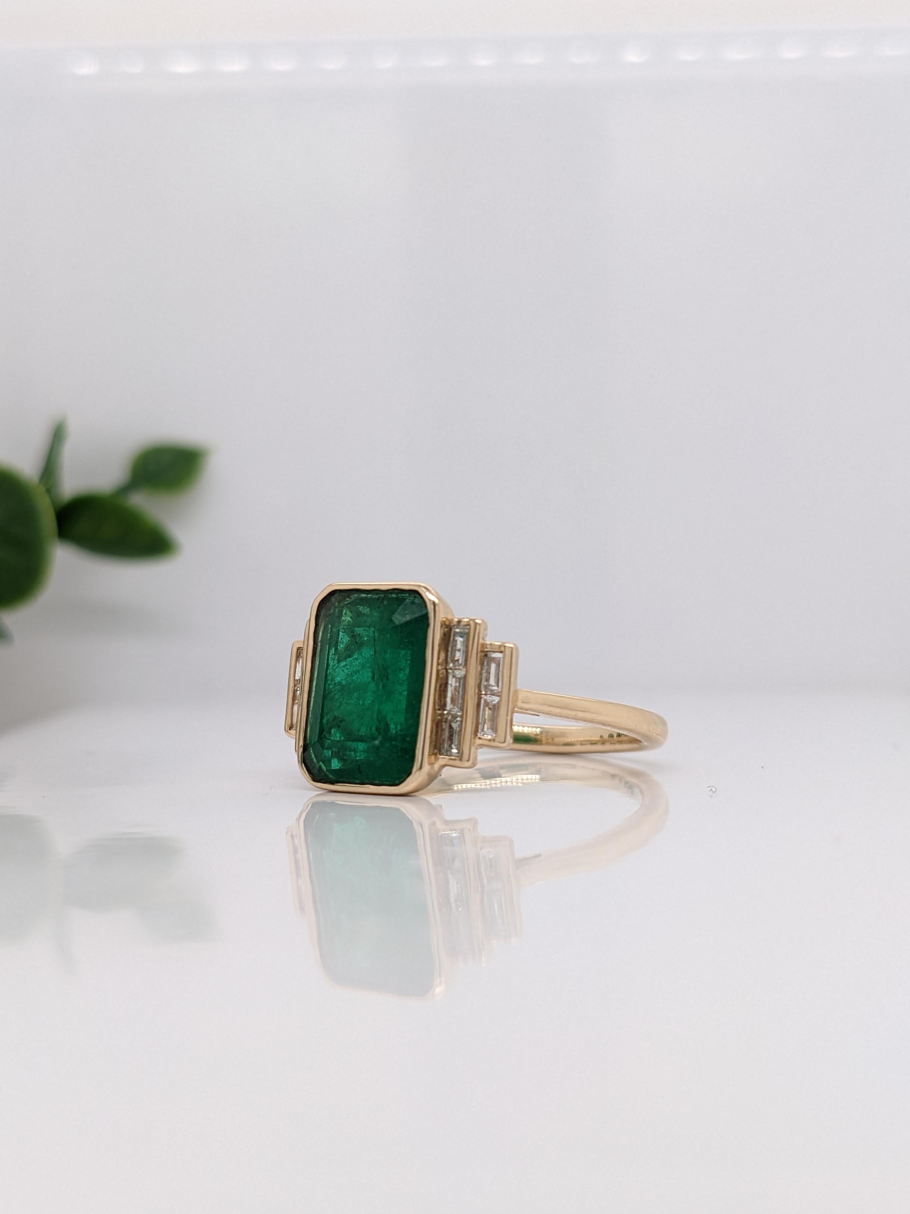 This gorgeous ring features a 3.03 carat emerald gemstone with natural earth mined baguette diamond accents, all set in solid 14k gold. This ring makes a beautiful may birthstone ring for your loved ones! 

Specifications

Item Type: Ring
Center
