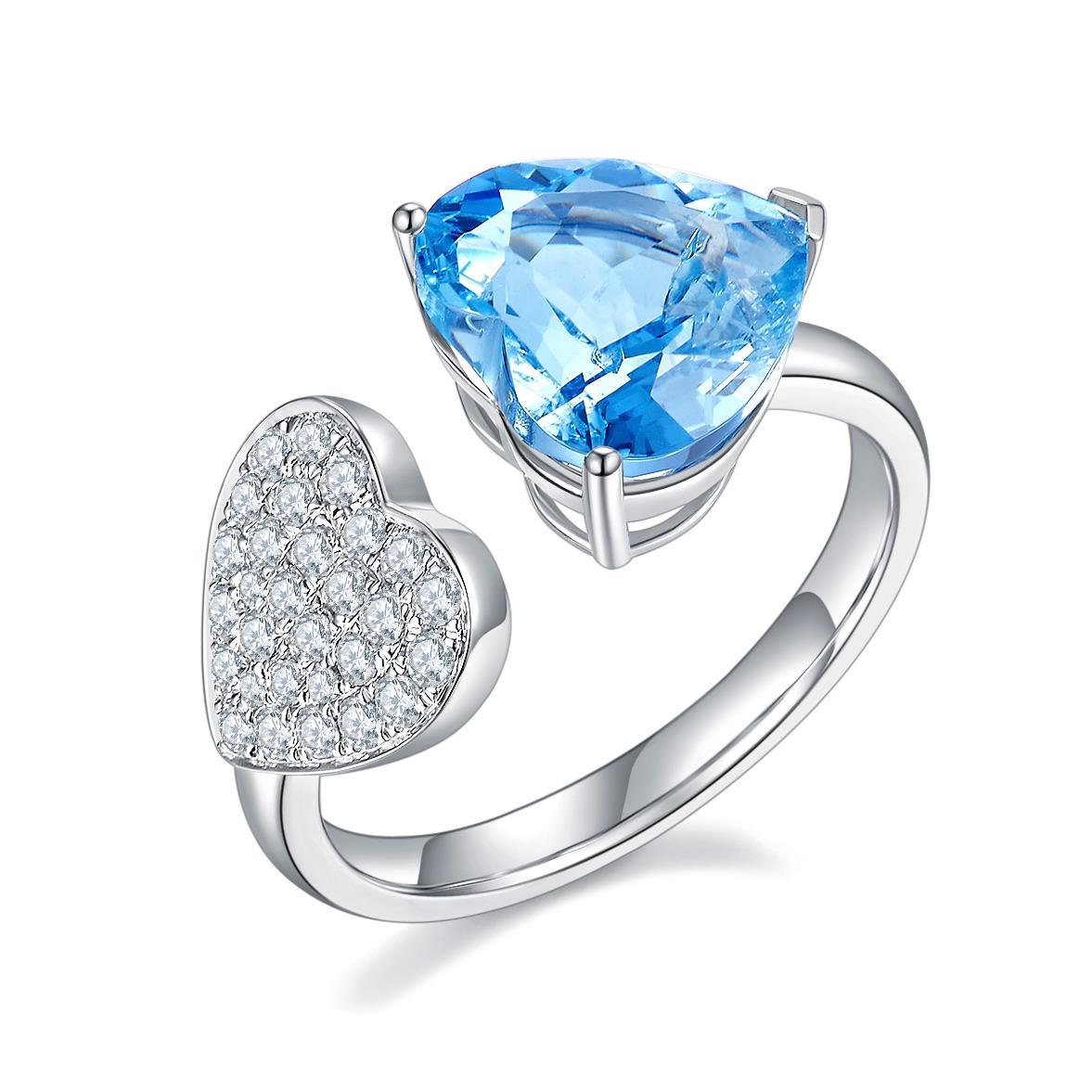 A 3 ct Aquamarine heart and Diamond Open Ring in 18k White Gold
It consists of a 3ct transparent Heart shape brilliant cut Aquamarine 
The Aquamarine is in Intense Blue colour, also known as 
