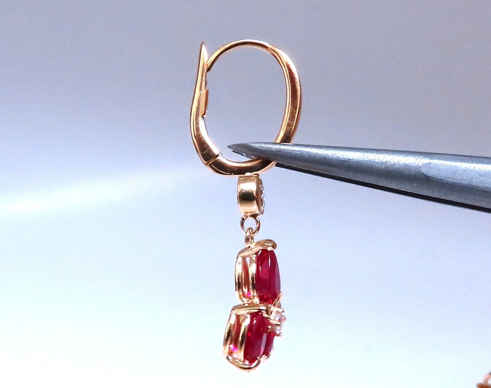 Ruby Diamond Cluster Dangle Earrings 

3.00ct Natural Red Ruby 


Clean clarity, full pear shape cuts 

All transparent.



Natural Diamonds: .30ct.
full cut rounds

 H color Vs2 clarity.

14KT yellow gold.

4 grams

Comfortable clip on

Overall