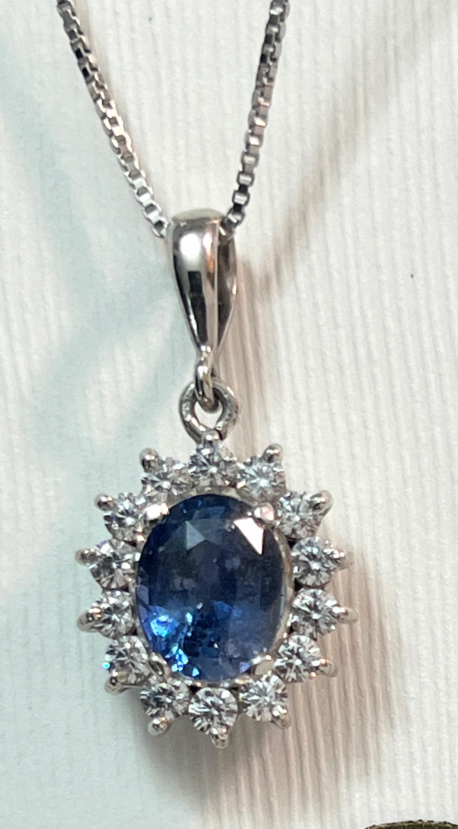 Our 3ct Oval Natural Blue Sapphire Platinum Silver Pendant Necklace set in prong is a radiant masterpiece that exudes timeless elegance and charm. This pendant is a true embodiment of sophistication and grace, perfect for adding a touch of luxury to