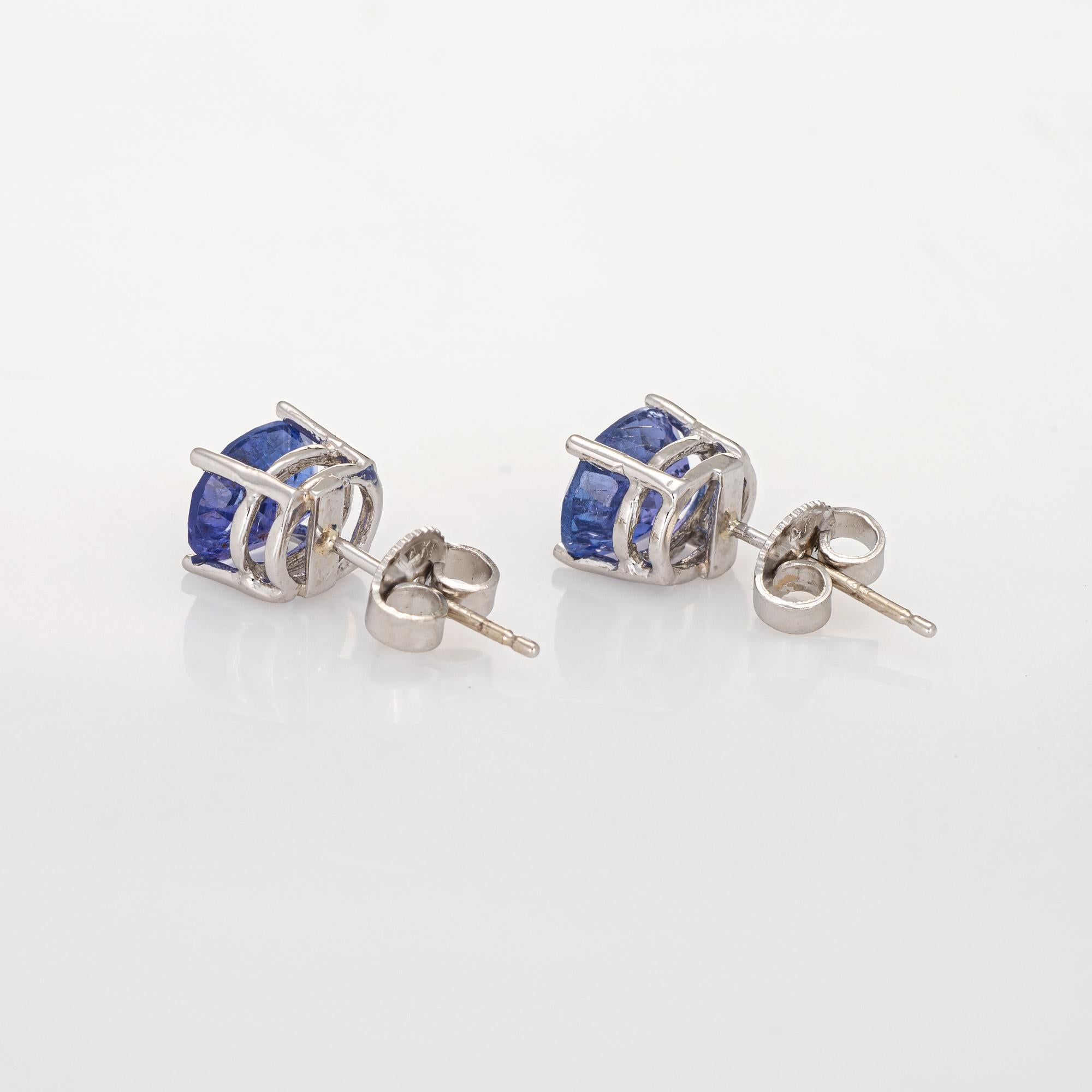 Elegant pair of tanzanite stud earrings crafted in 14k white gold. 

Oval faceted tanzanite measures 8mm x 6mm (estimated at 1.50 carats each - 3 carats total estimated weight). The tanzanite is in excellent condition and free of cracks or chips.