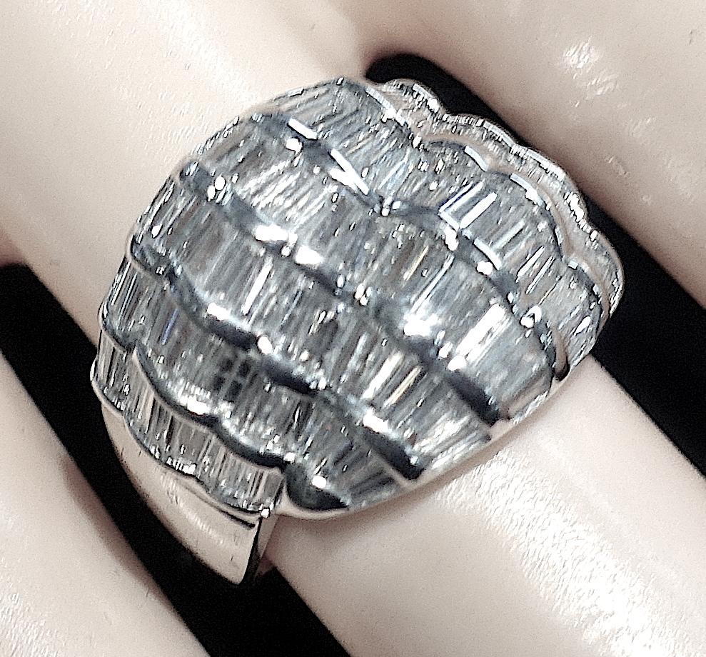 This stunning ring features 3cts of VS Baguette cut diamonds in an 18kt white gold setting.  In excellent condition, this ring is a size 5 and measures 5/8” across the top.  