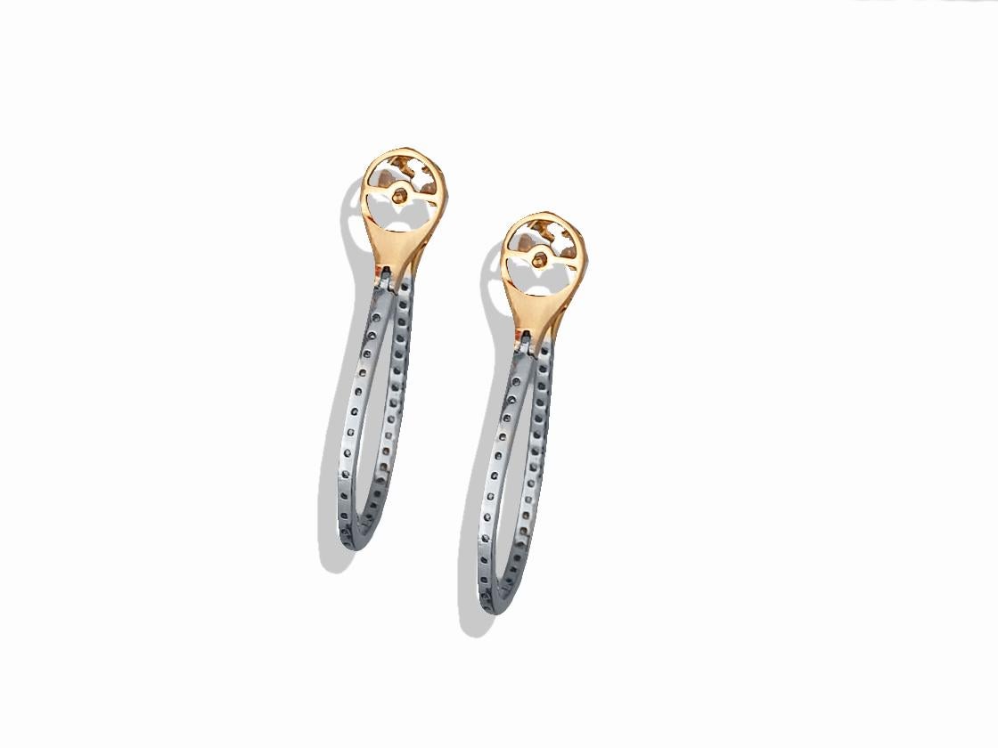 This pair of hoop earrings contain the following.  Each earring has seventy round brilliant diamonds that measure between 1.65-1.85 mm and a color and clarity of F-G VS-SI.  The diamonds are set in a 