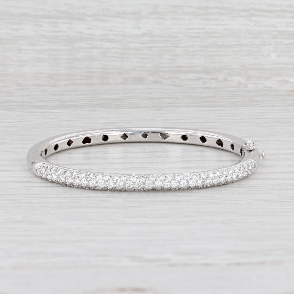 Gem: Natural Diamonds - 3 Total Carats, Round Brilliant Cut, G - H Color, VS2 Clarity
Metal: 18k White Gold
Weight: 29.6 Grams 
Stamps: 18k
Style: Bangle Bracelet
Closure: Hinged, Slide & Latch
Inner Circumference: 6 1/2