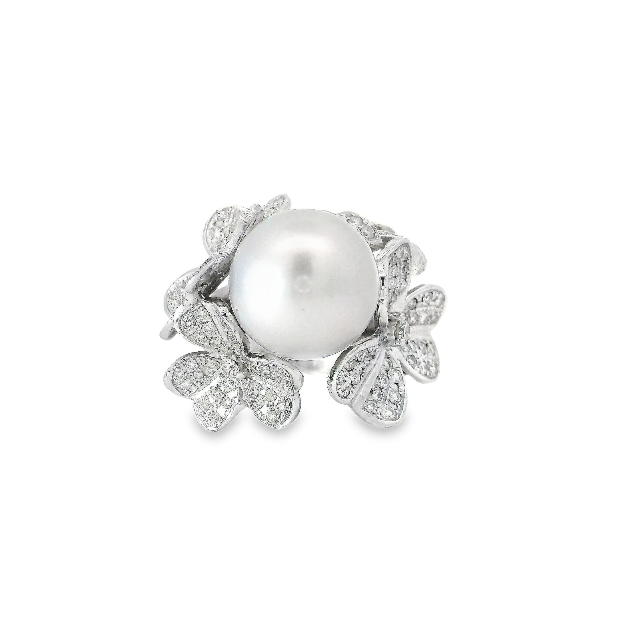 Radiate sophistication and luxury with this stunning silver white pearl ring in 18K white gold. At the centre lies a breathtaking 12.5mm South Sea pearl of the finest quality, its lucent surface gleaming with an inner radiance. Surrounding the pearl