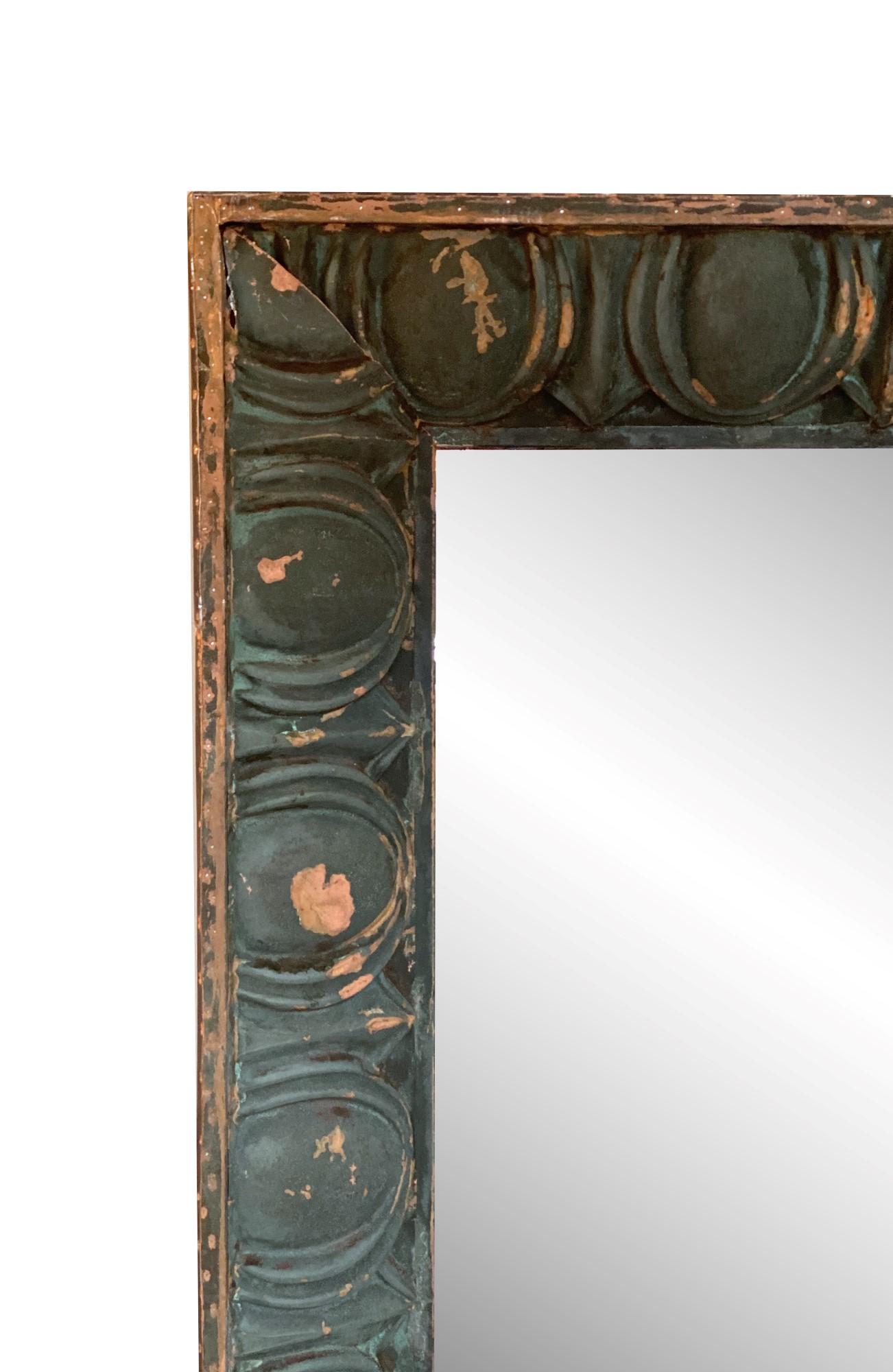 New mirror made from a reclaimed turn of the century copper building facade's soffit. Beefy 3 dimensional frame. This can be seen at our 333 West 52nd St location in the Theater District West of Manhattan.