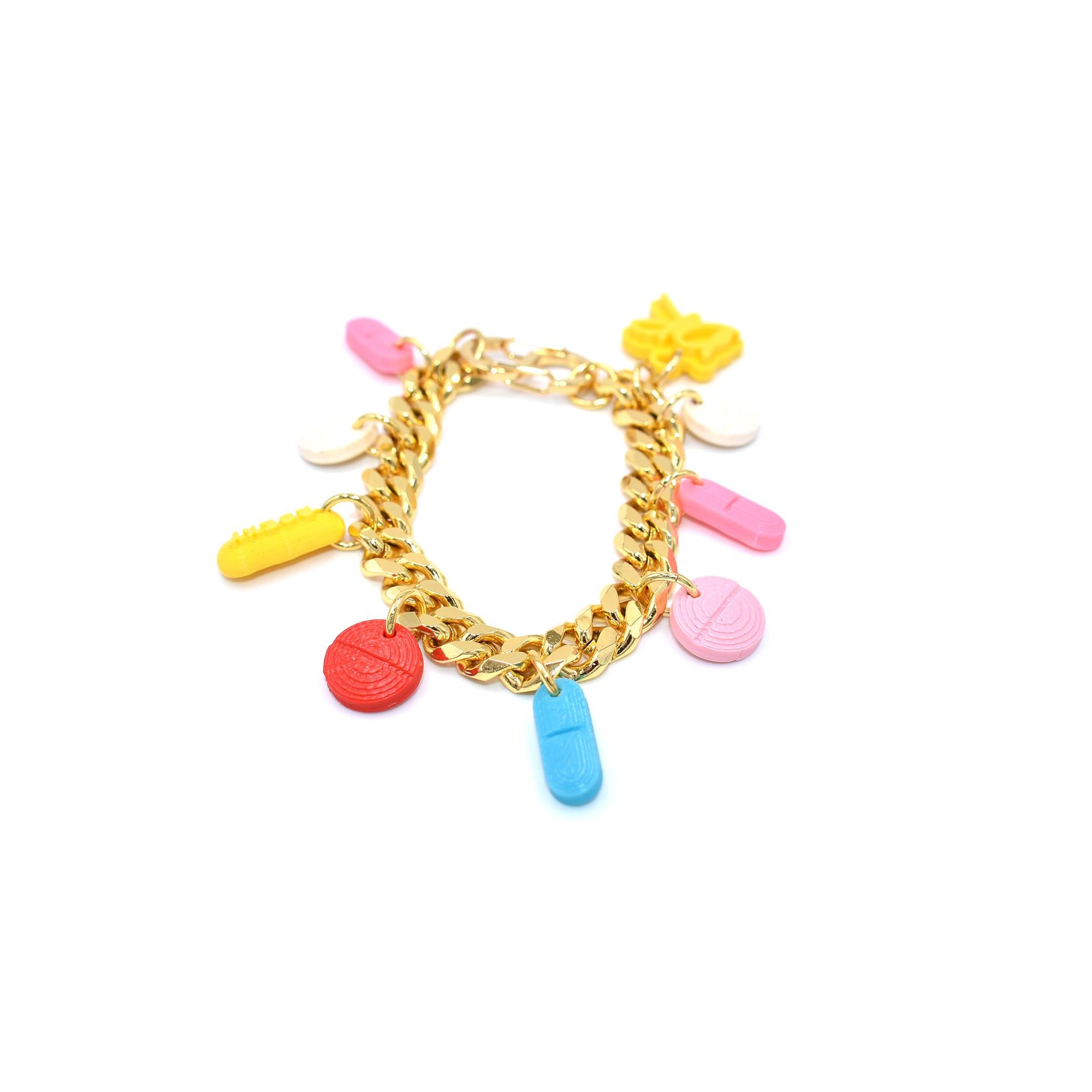So sexy it hurts! As seen on P!nk and Coi Leray.
An assortment of 3d printed pill charms hang from a gold plated stainless steel bracelet, no two bracelets are alike! 7 1/2