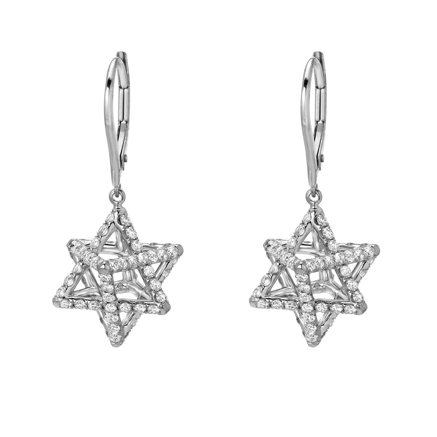 The 3D Star of David Platinum Diamond Earrings showcase a suspended, three-dimensional Merkaba tetrahedron measuring 0.57 inches. This intricate design is adorned with approximately 2.02 carats of round brilliant diamonds with F-G color and VVS2-VS1