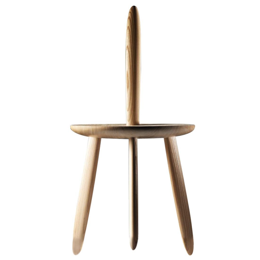 The original design concept of 3DWN1UP consists in the most simple and performative chair design, made of 5 wood parts taken from 1 single piece of wood. The piece is part of the Wood collection of Aldo Bakker. The artist has explored this design