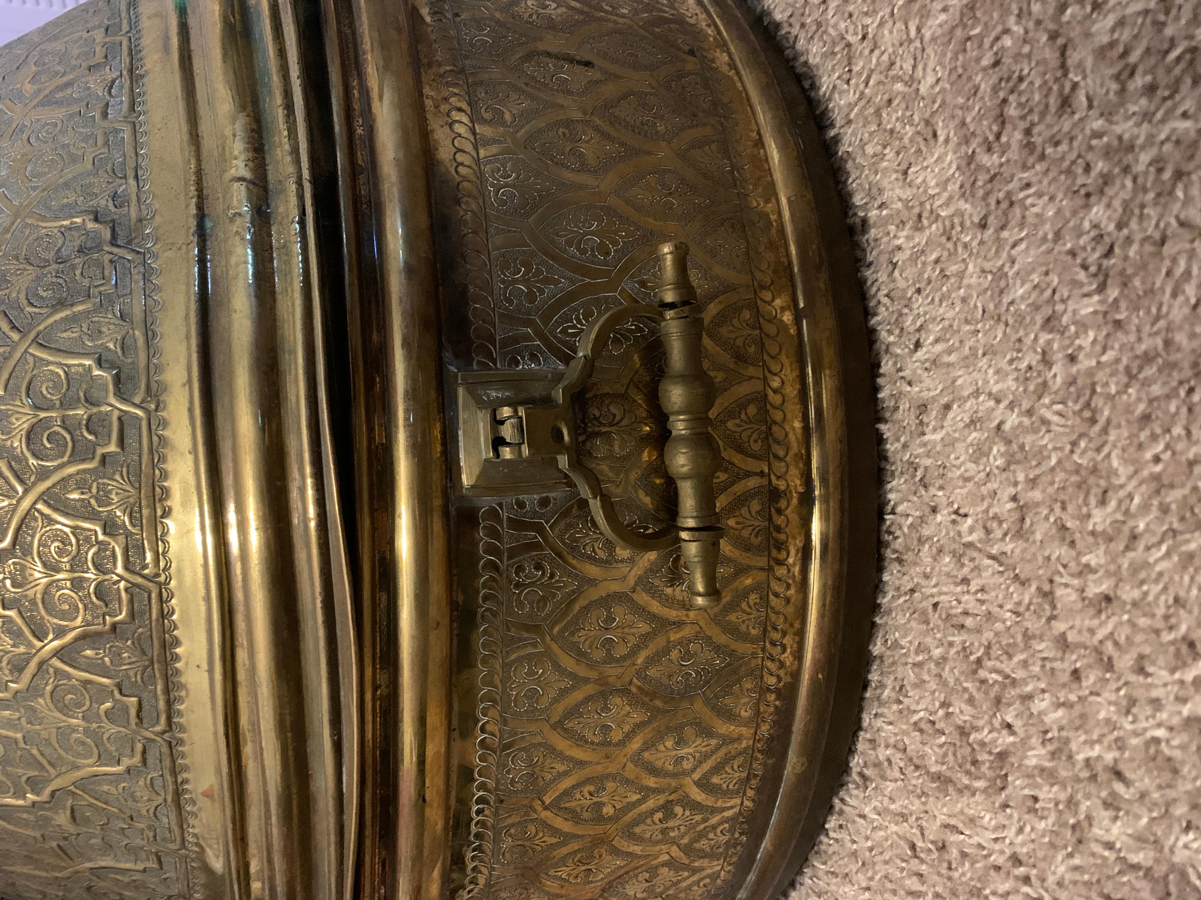 Large handcrafted brass tagine with cone cover and a brass final. Beautiful decorative hand beaten Ottoman designs across its surface. Measure: 3ft.

The history of tagine dates back to the time of Harun al-Rashid, the fifth Abbasid Caliph. The