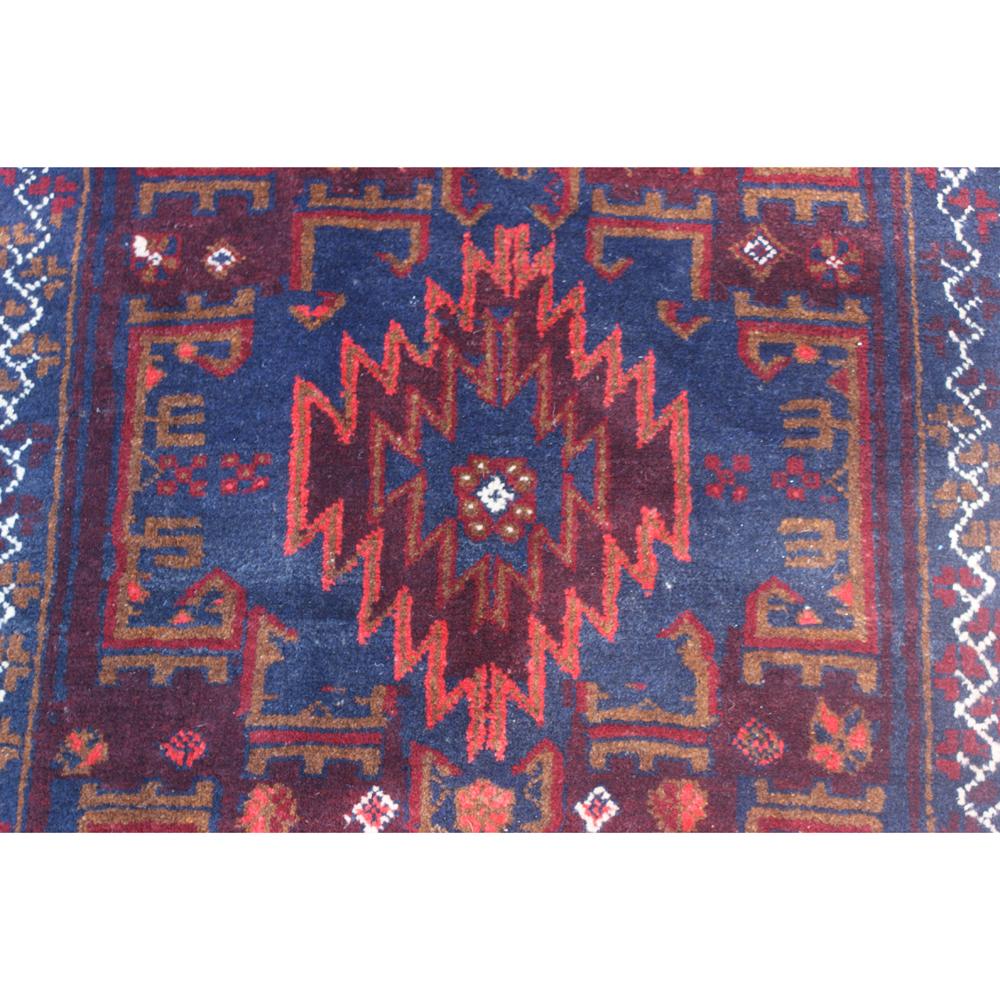 Hand knotted Afghan Baluchi rug, measures: 3.03 ft. x 6.07 ft
1970s

Baluch rugs are also known as Baluchi or Beluchi. These rugs are hand knotted by the nomads of Baluch. 

Baluch or Baluchistan is the area between the borders of Iran,