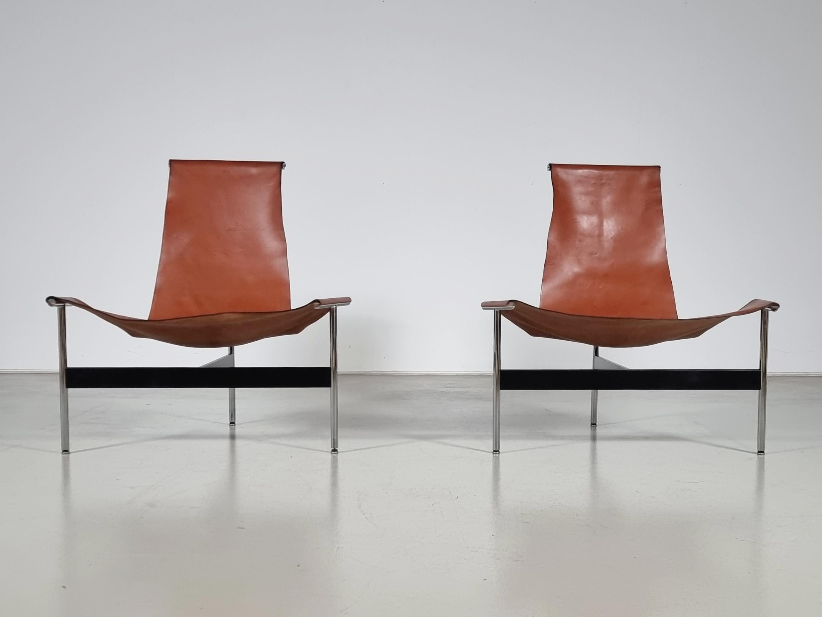 Rare lounge versions of the 3LC chairs, better known as T-chairs. Chrome-plated and enameled steel with original cognac leather sling, designed by William Katavolos, Ross Littell, and Douglas Kelley. By Laverne International's 