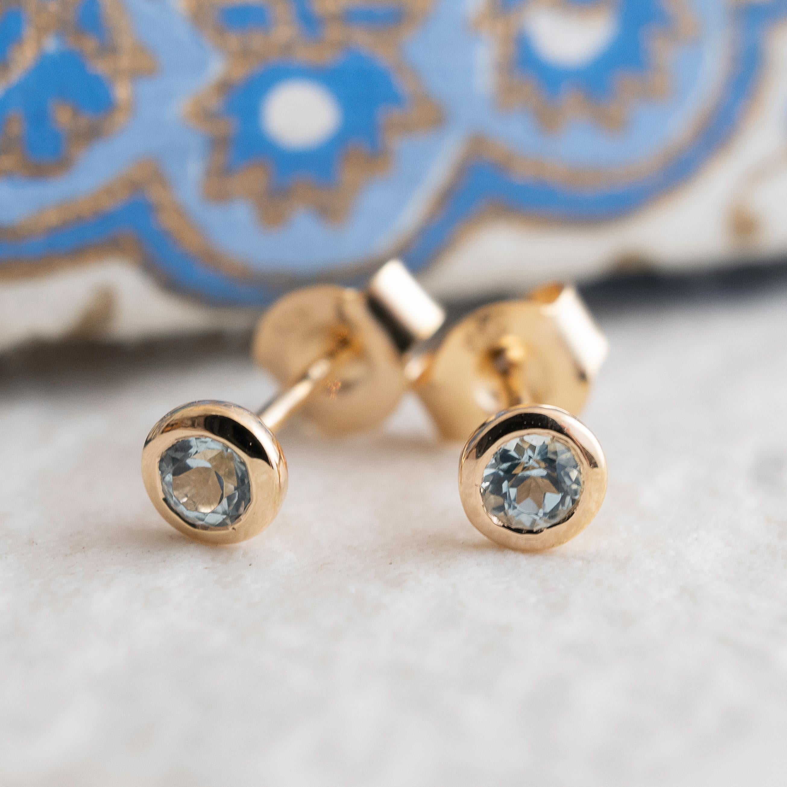 3mm faceted round Blue Topaz is set in gold plated sterling silver. Diameter for earrings are approximately 4mm. 