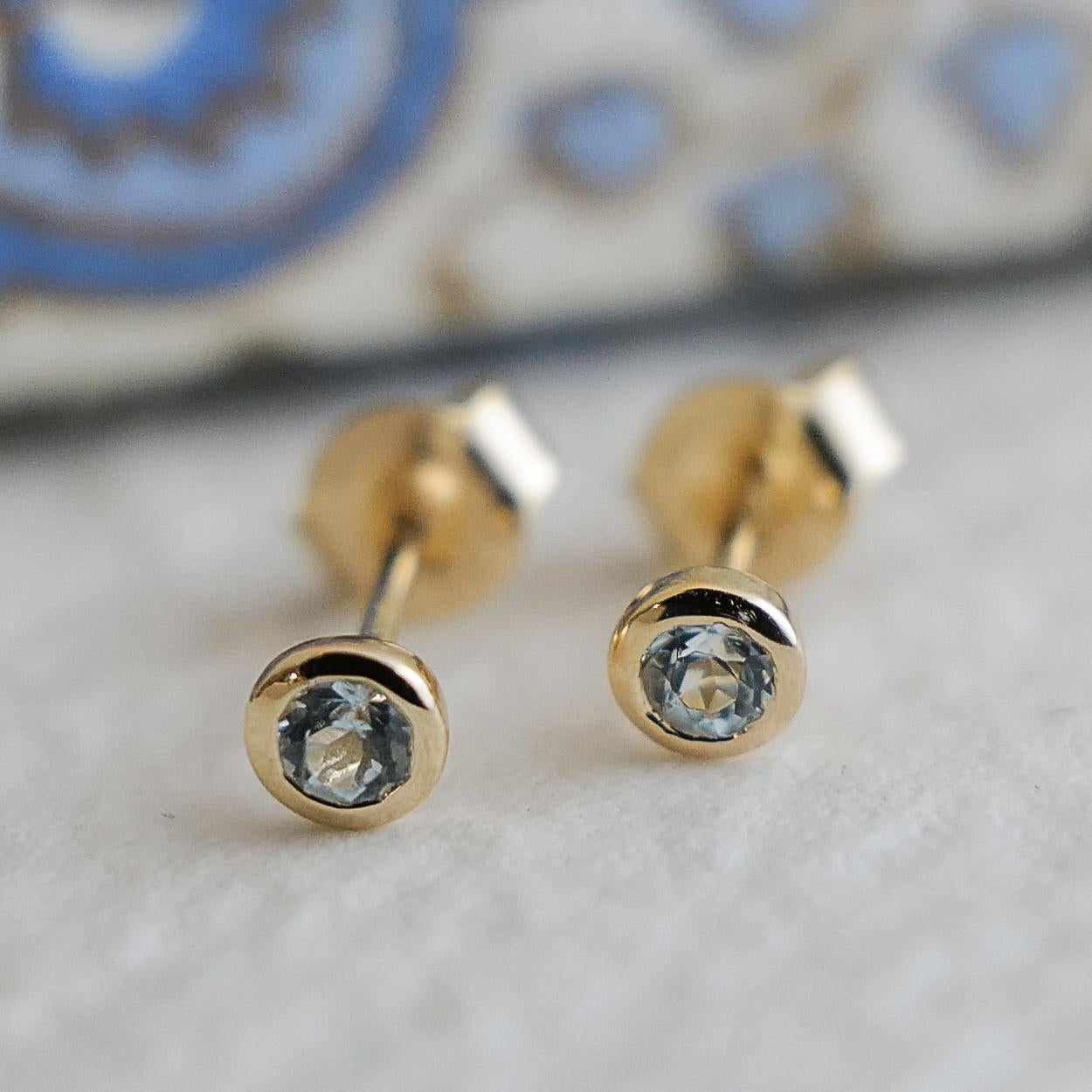 Women's 3mm Blue Topaz Gold Plated Sterling Silver Stud Earrings For Sale