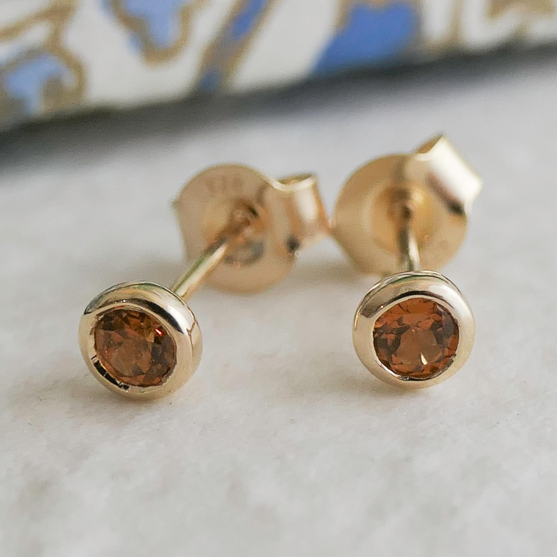 3mm faceted round Hessonite Garnet is set in gold plated sterling silver. Diameter for earrings are approximately 4mm. 