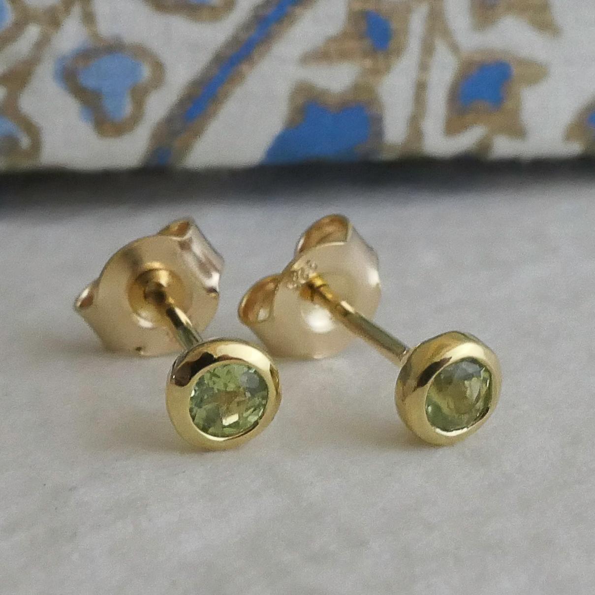 3mm faceted round Peridot is set in gold plated sterling silver. Diameter for earrings are approximately 4mm. 