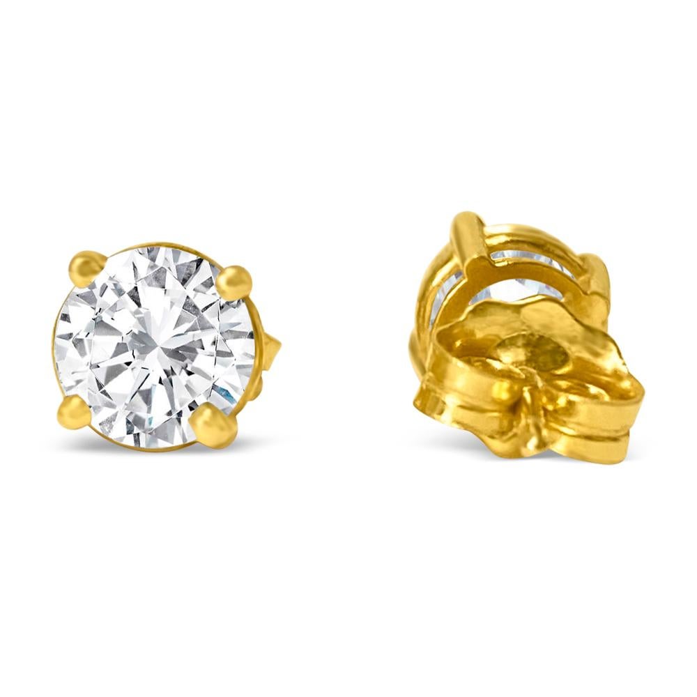 Crafted from exquisite 14K yellow gold, these unisex diamond studs feature 3mm round brilliant cut diamonds totaling 0.25 carats. With VVS-VS clarity and H-I color, these natural earth mined diamonds are elegantly set in a classic 4-prong style,