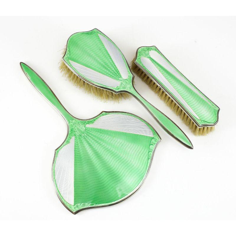 3pc Birmingham sterling silver vanity set by James Dixon & Sons, Mirror, 1930

Set Includes Hand Mirror, Clothes Brush, & Hair Brush. Features Stunning Light Green Enamel with Makers Mark on all pieces.

Additional Information:
Brand:
