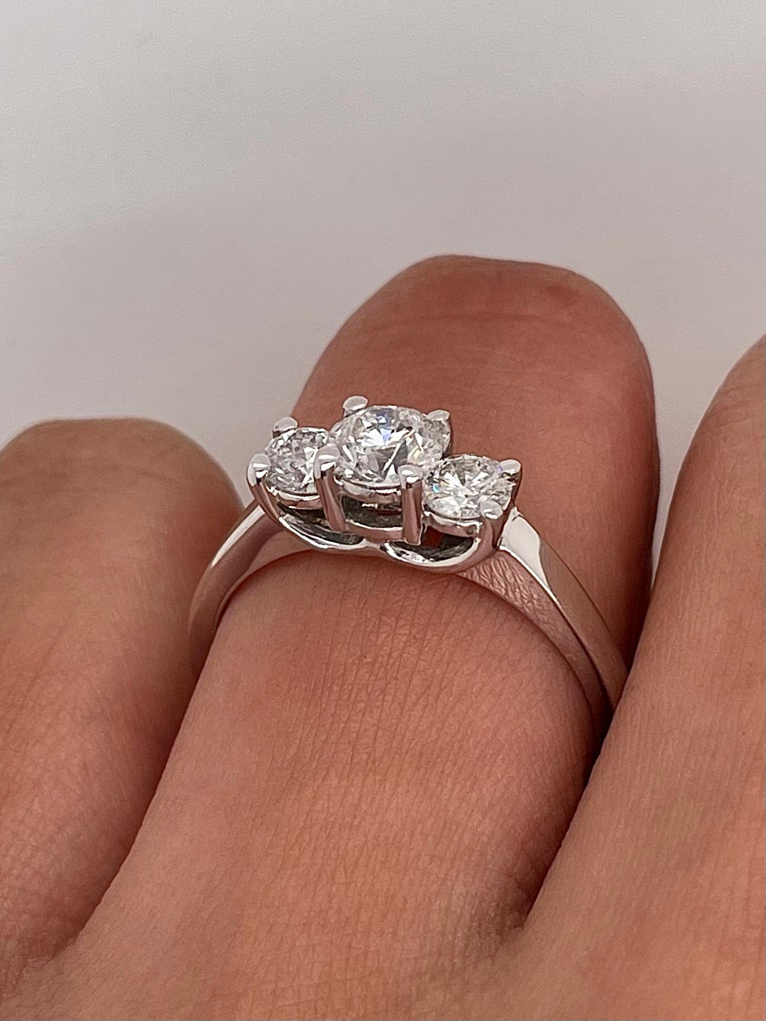 1.02 Carat Round Diamond Three Stone Engagement Ring F SI2
-Metal: 14K White Gold
-0.53 Carat Round Center Stone, F Color, SI2 Clarity
-0.49 Carat Side Stones, F Color, SI1/SI2 Clarity

-Ring Size: 8.5