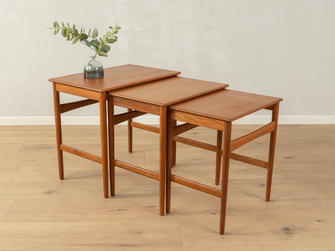 Classic nesting tables from the 1960s by Hans J. Wegner for Andreas Tuck. Veneered table top with solid wood edge and solid wood frame in teak.

Width 52 cm, height 48 cm, depth 34 cm
Width 46 cm, height 46 cm, depth 32 cm
Width 40 cm, height 44