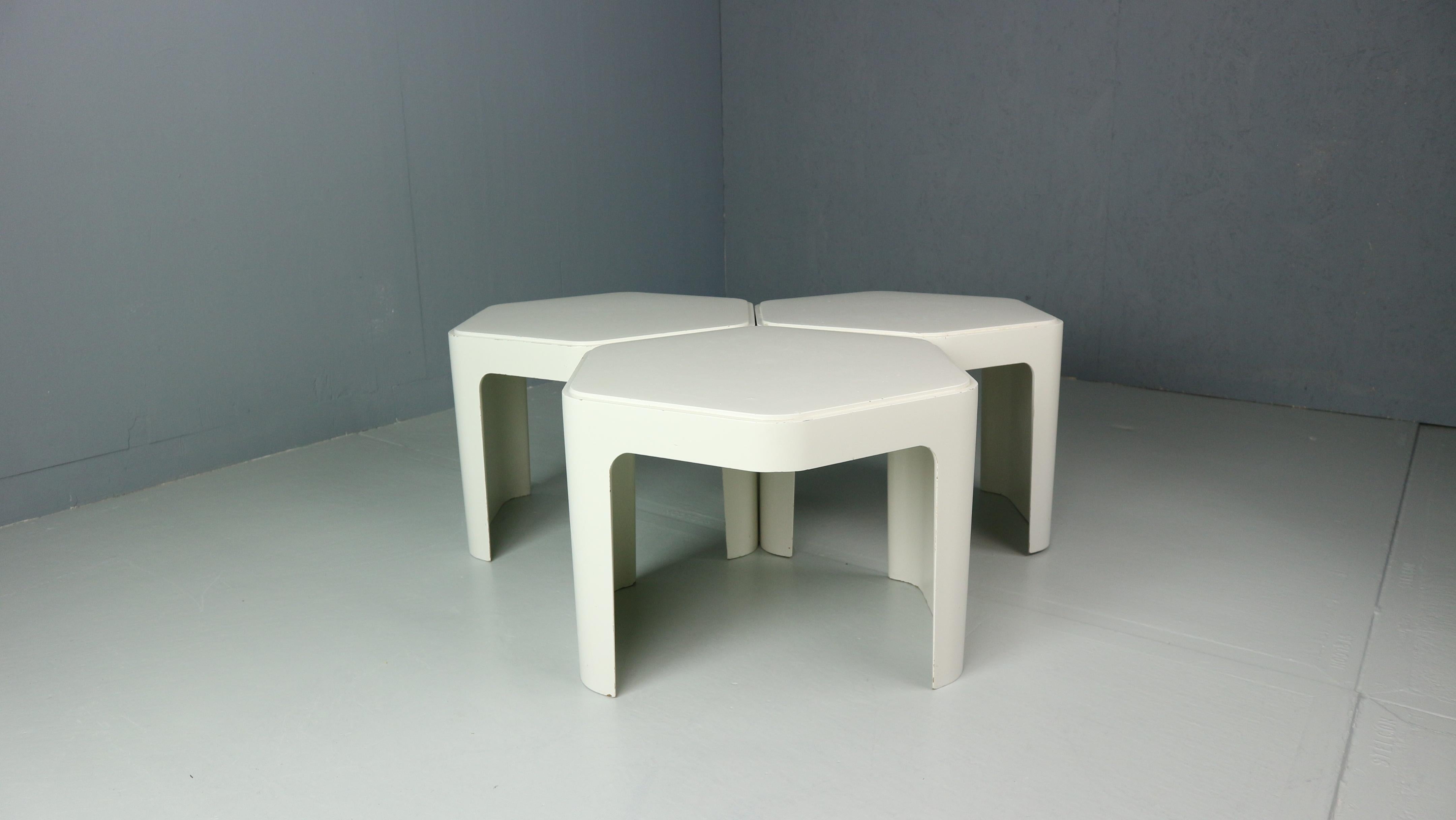 Very rare and stunning set of 3 vintage 1970s space-age side tables produced by the German brand Form + Life Collection and designed by Peter Ghyczy in 1972. The tables are made of fiberglass and can be stacked into a modular unit / storage or