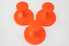3x Orange plastic hooks around 1970s